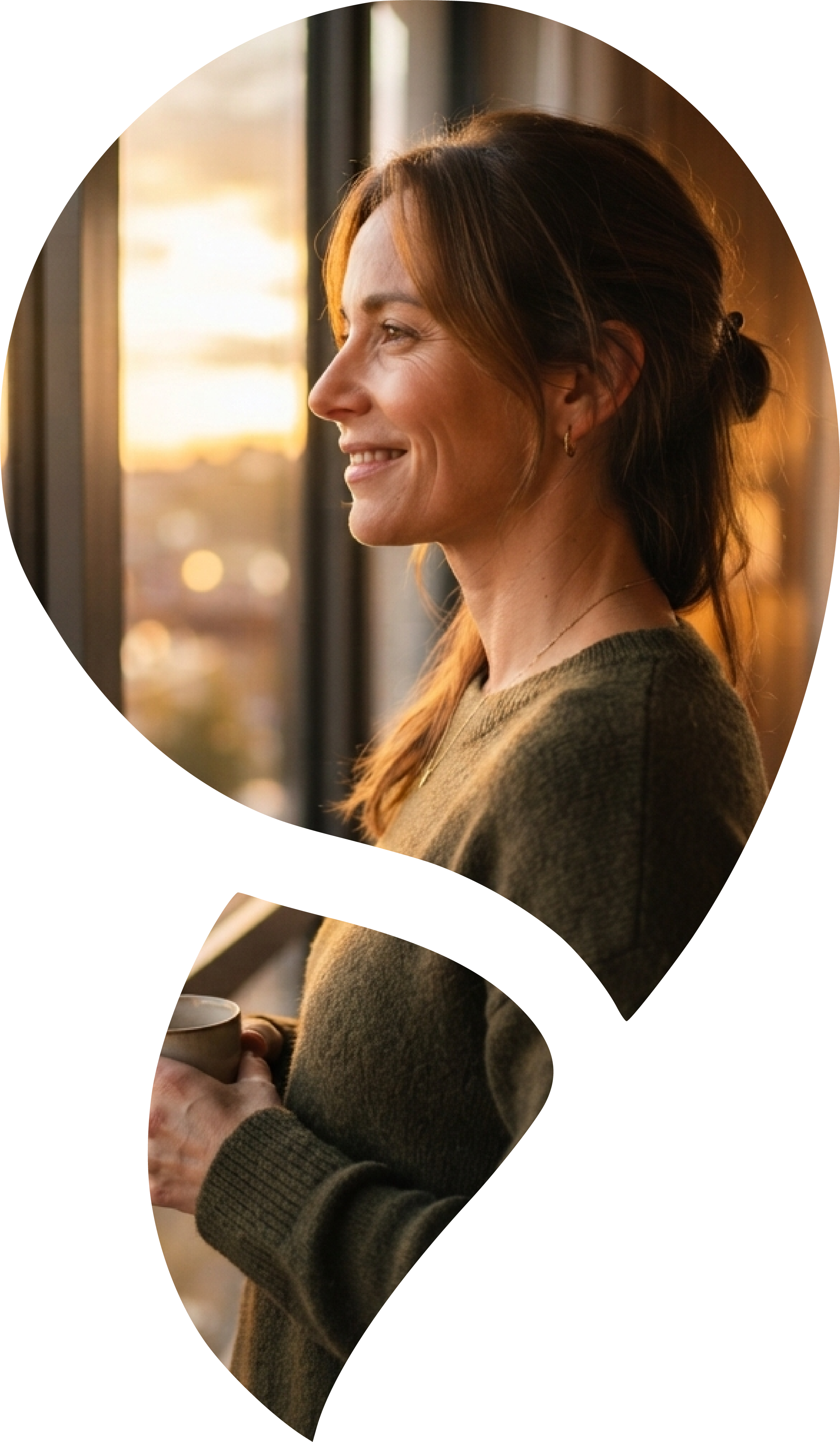 Woman in profile against a neutral background, representing reflection and personal change.