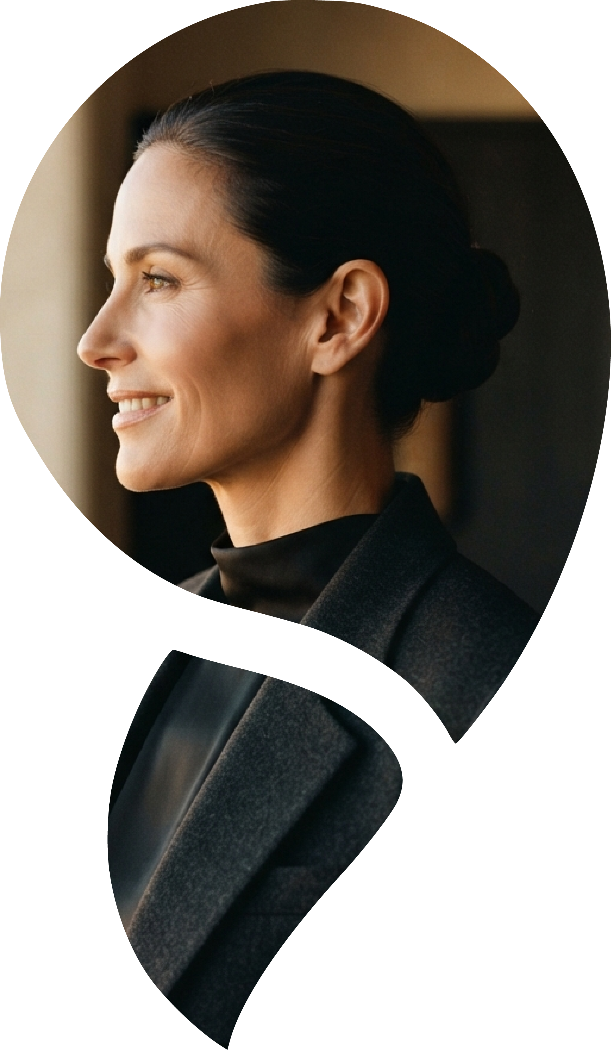 Kate Reddin, Melbourne counsellor and executive coach, wearing a dark blazer beside a softly lit window.