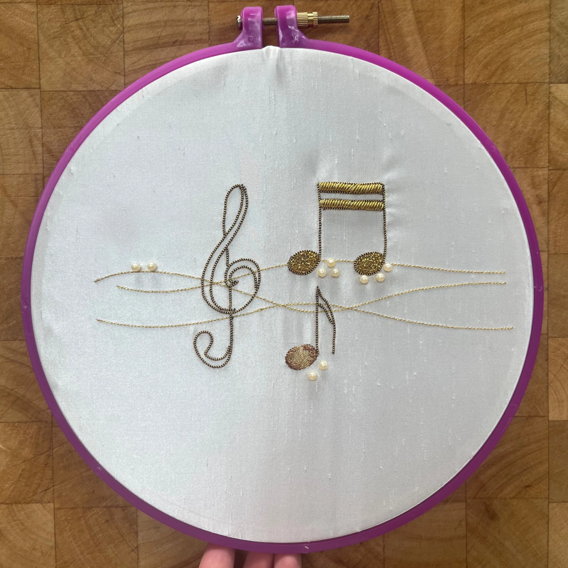 Embroidered hoop musical design, using goldwork, machine embroidery and beading