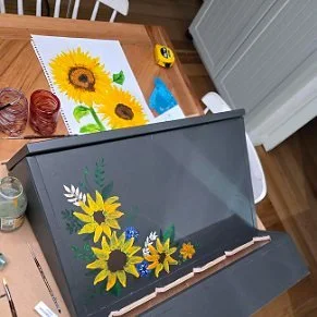 Painting a chicken feeder