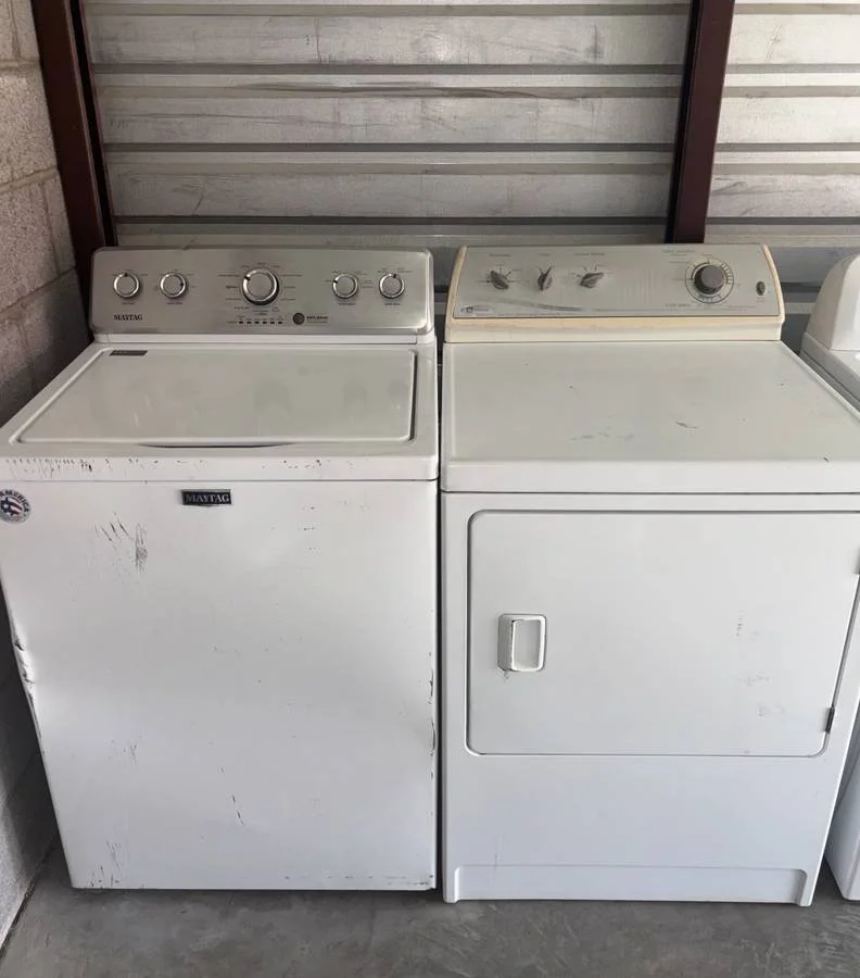 A washer and dryer set removed from a home and ready for hauling by PHX Valley Junk Removal