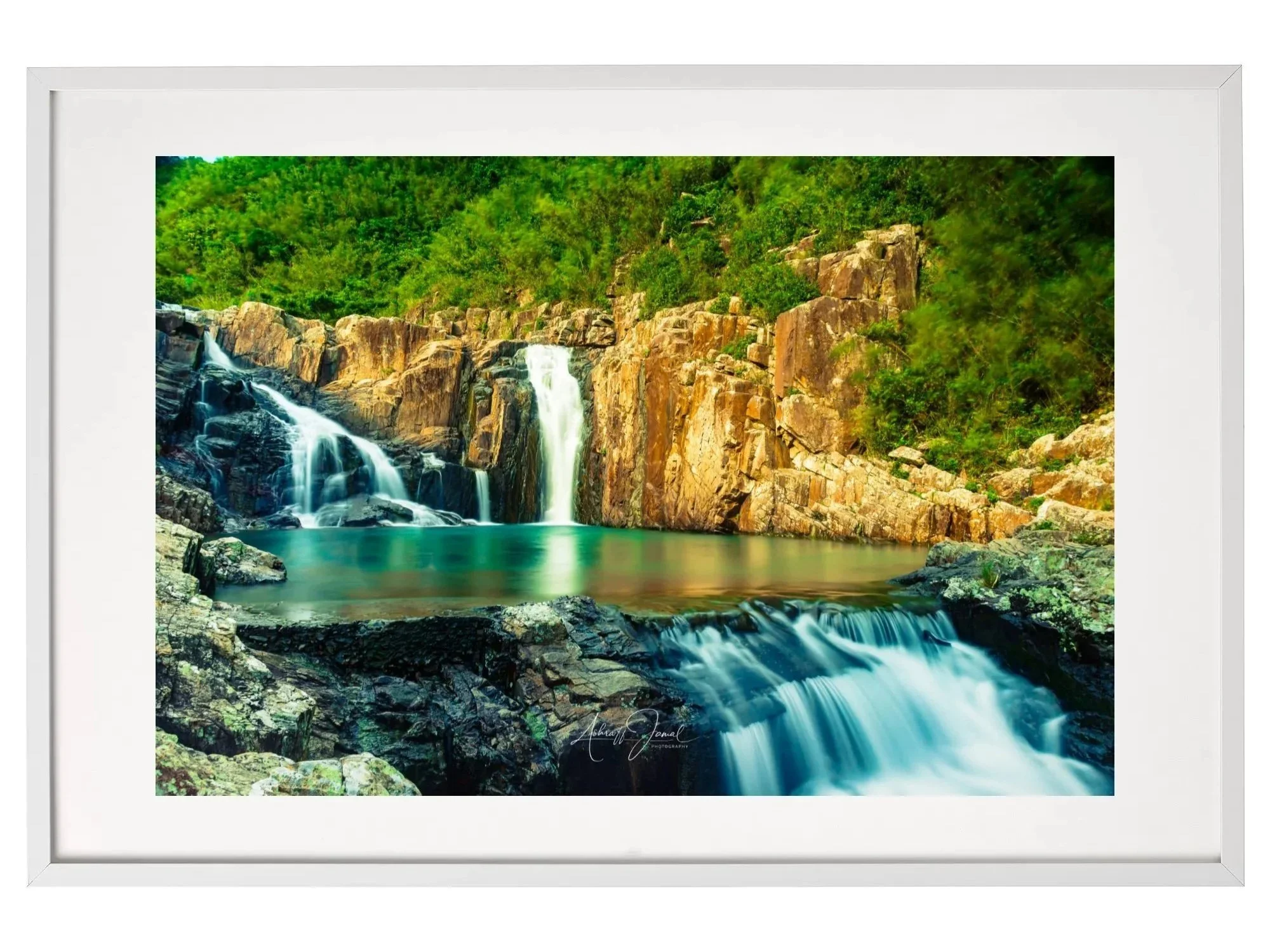 Framed fine art landscape print of the emerald Sai Kung Rock Pools in Hong Kong, presented in a minimalist white gallery frame with a white mat.
