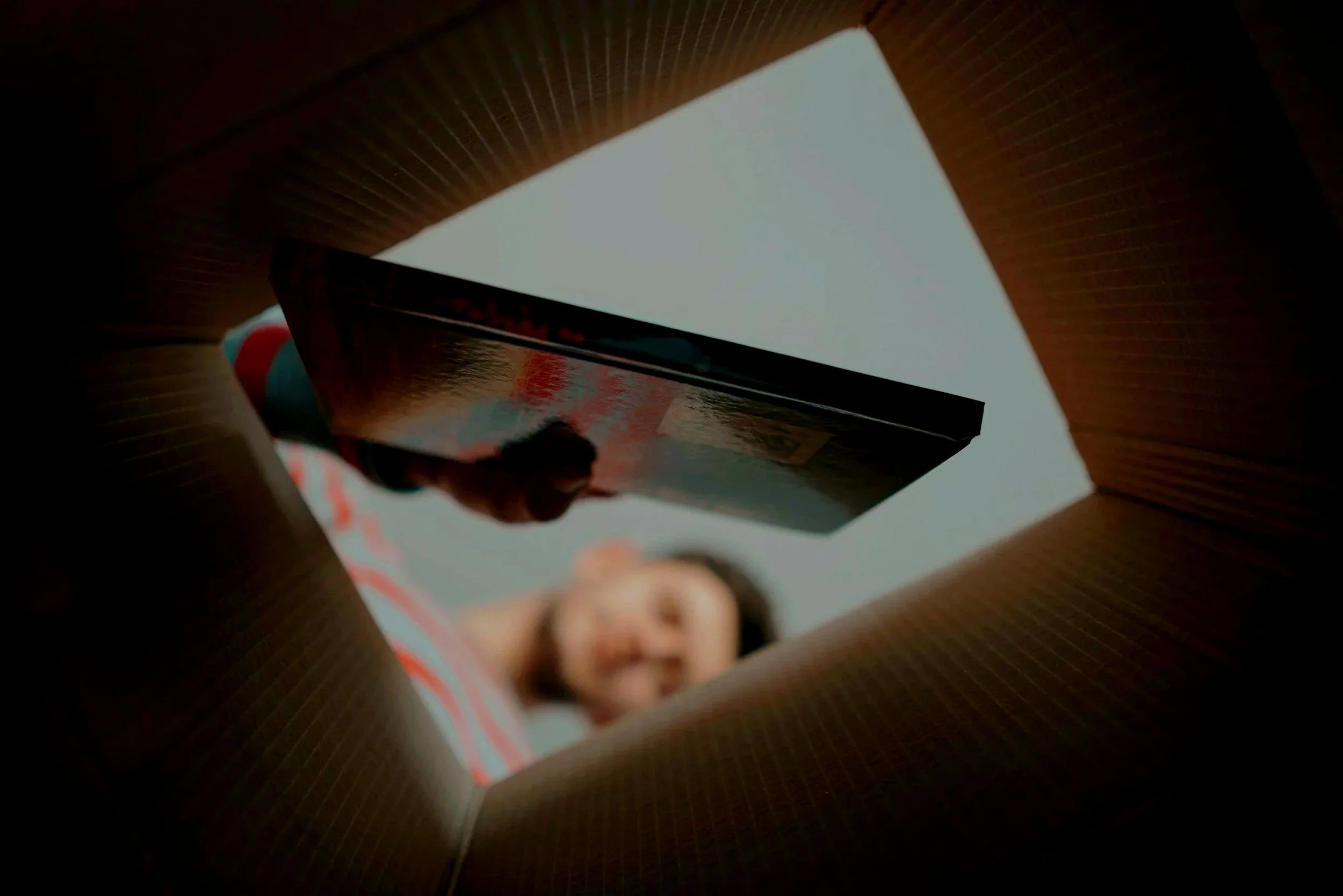 Unboxing a premium Ashraff Jamal fine art print from a secure shipping carton for customer return policy review.