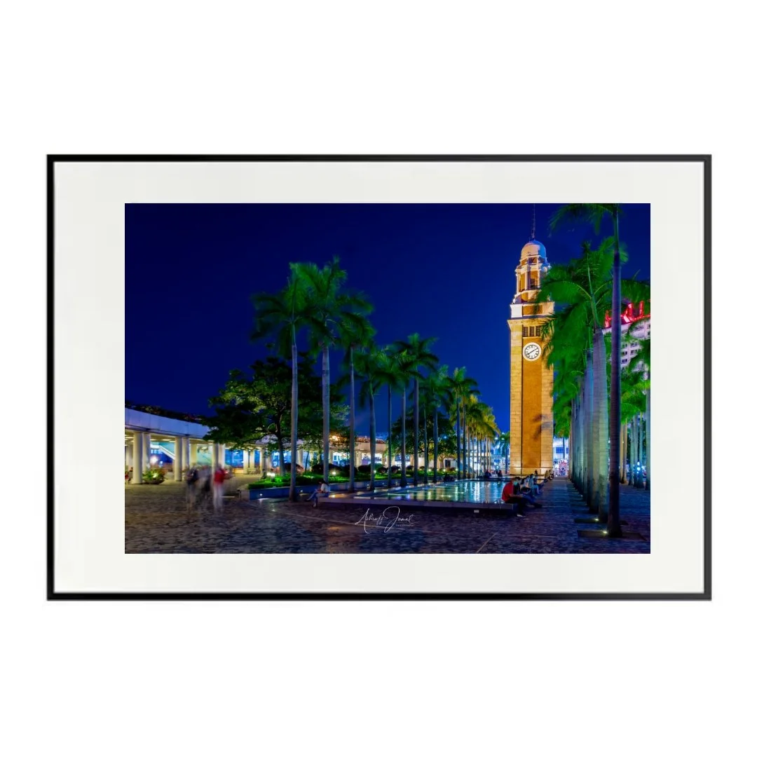 Hong Kong Clock Tower night print in a black frame.