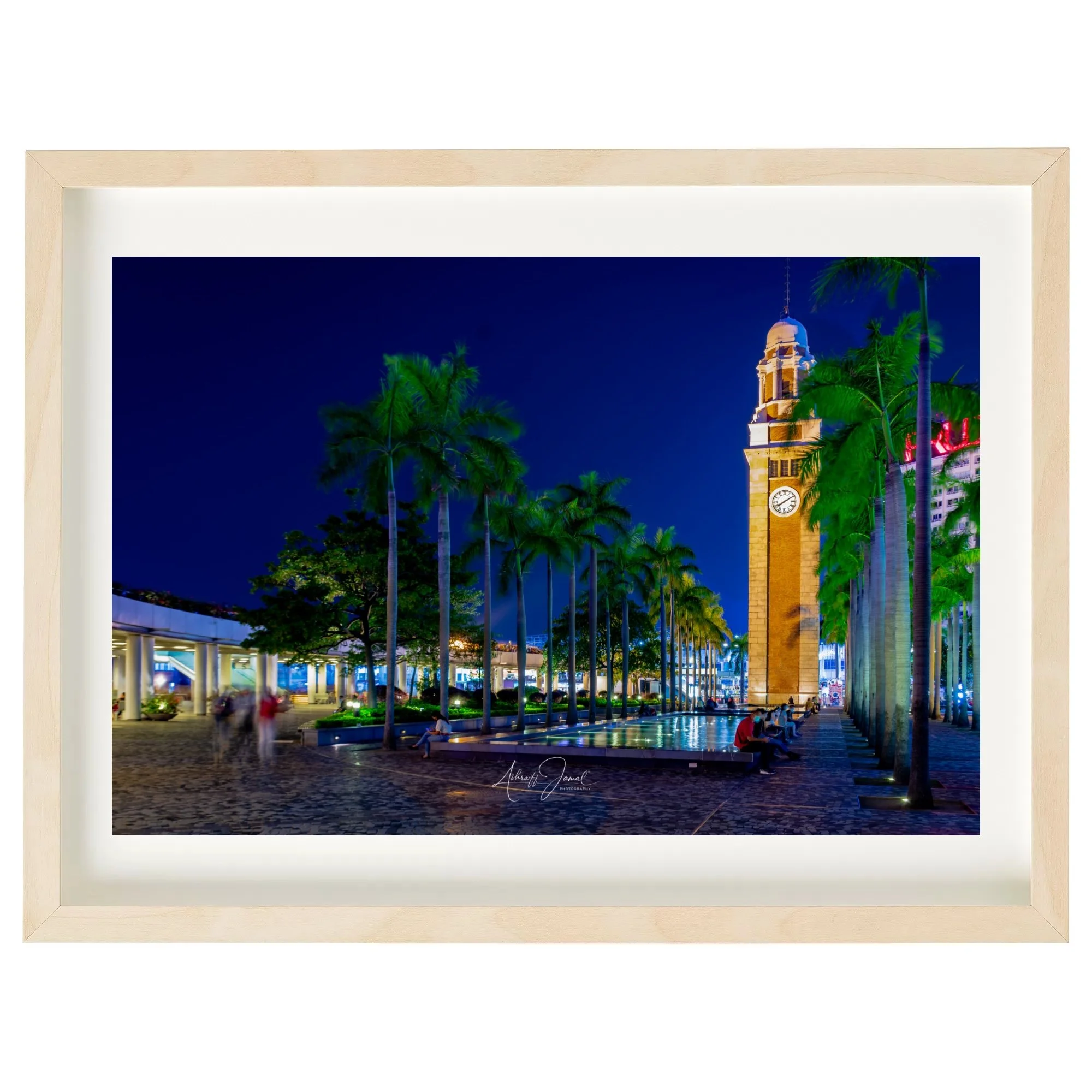 Hong Kong Clock Tower night print in a natural wooden frame.