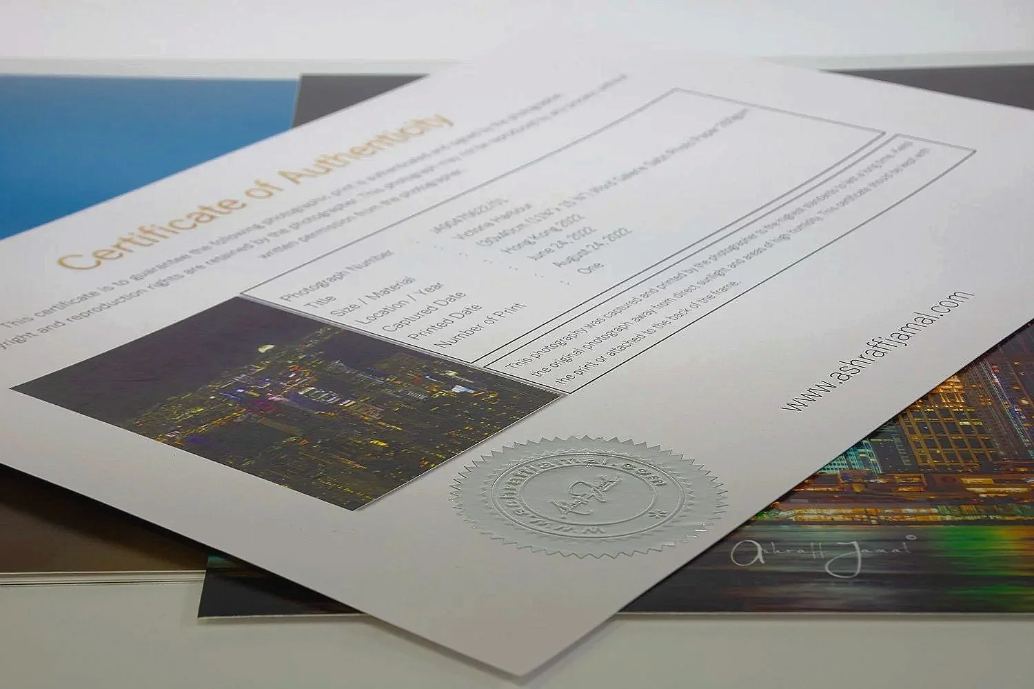 Signed Certificate of Authenticity with an embossed silver foil seal for an Ashraff Jamal fine art print.