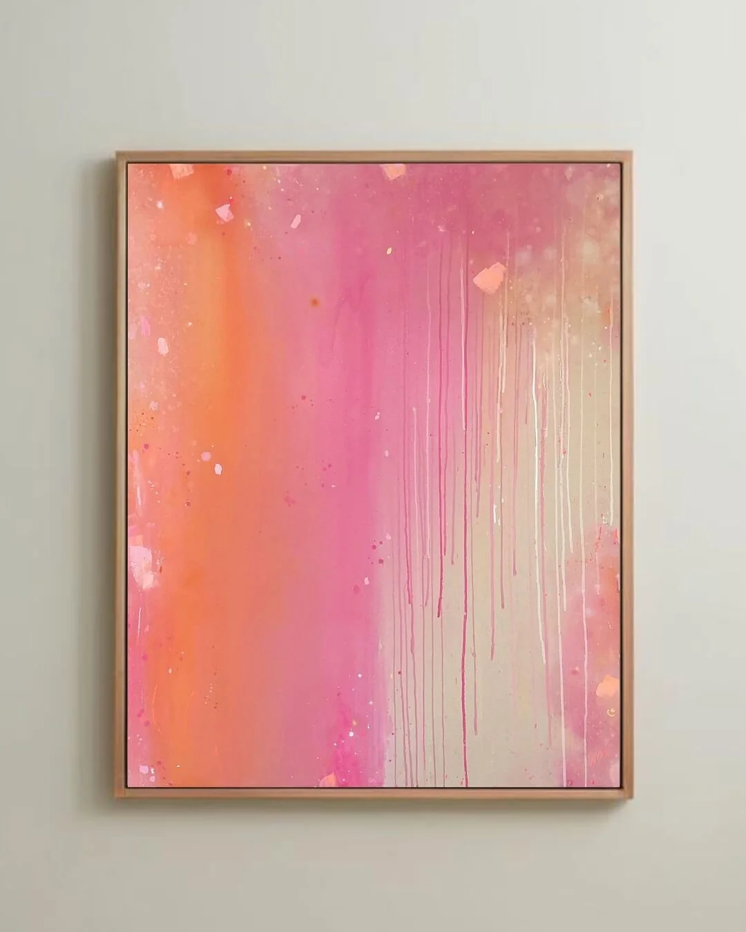 Dreamy sunset-inspired abstract canvas art depicting soft color transitions of coral and pink with gentle downward paint drips by Vanessa Ochi.