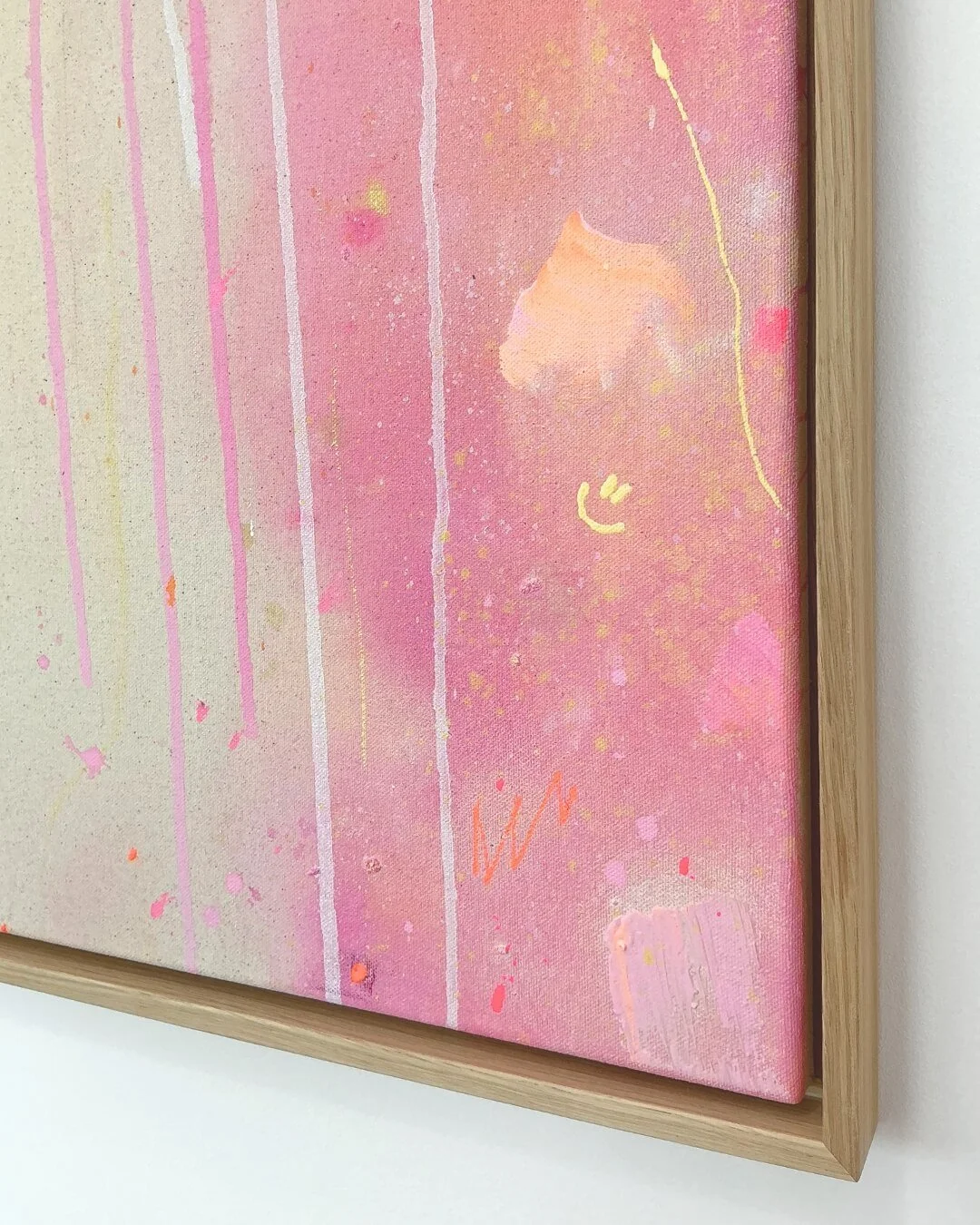 Detail shot showing the soft blending of orange, rose, and pink paint with subtle texture and dripping effects