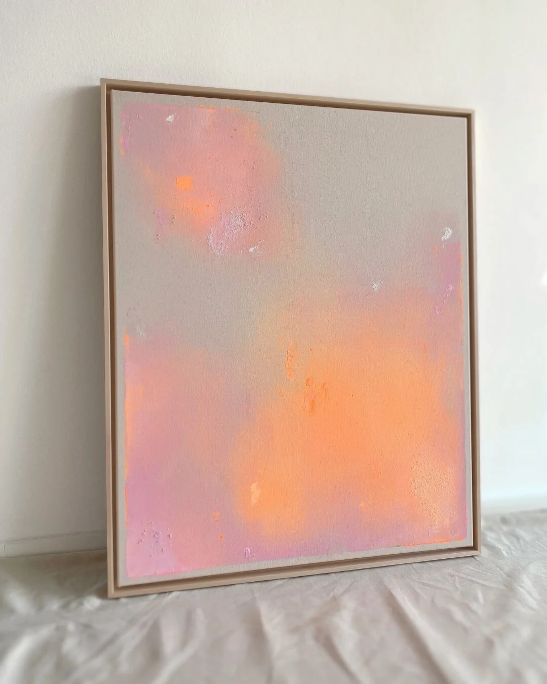 Full front shot of the abstract artwork Peachy Glow Dust I, depicting a luminous composition inspired by early summer morning light by Vanessa Ochi