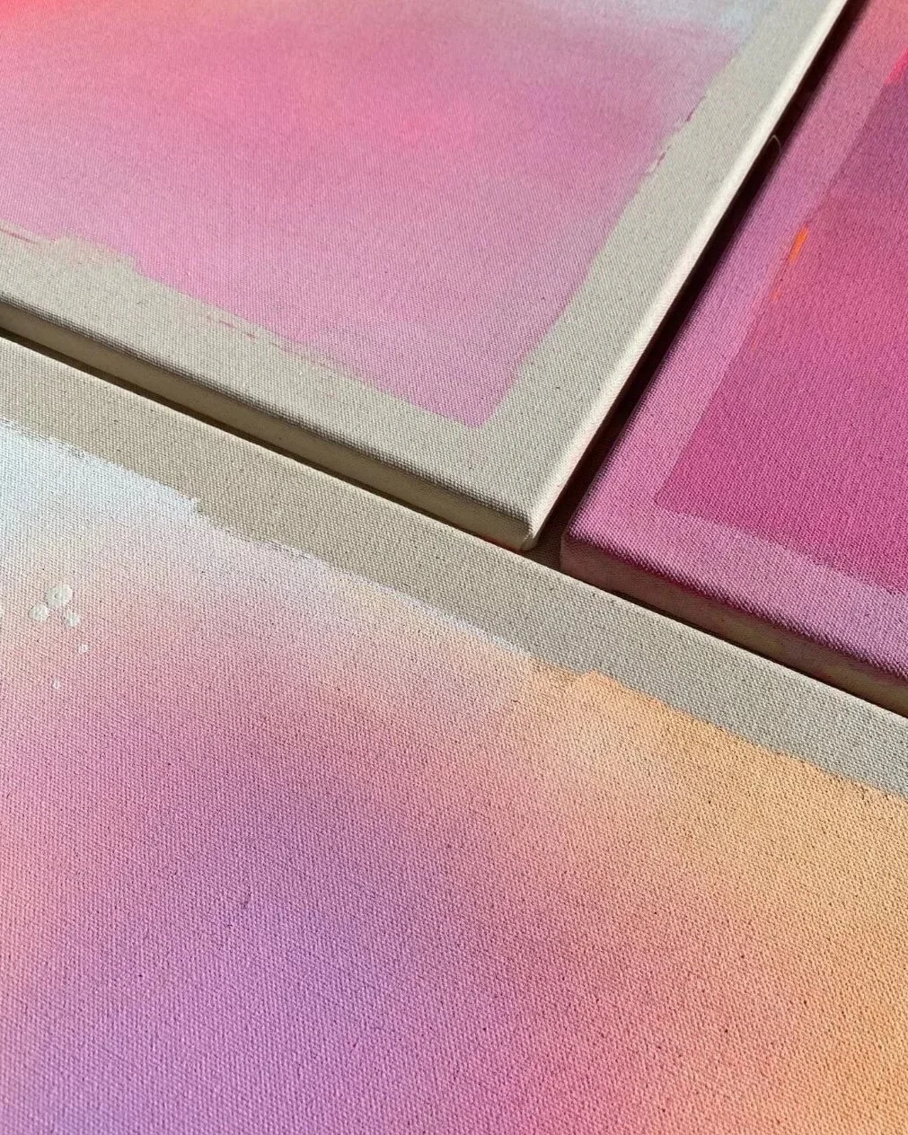 Close-up detail over radiant neon orange and pink gradients by Vanessa Ochi