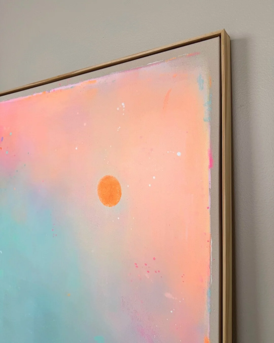 A close-up shot of an artwork from the *Michigan Sun* series in pink, orange, and turquoise.