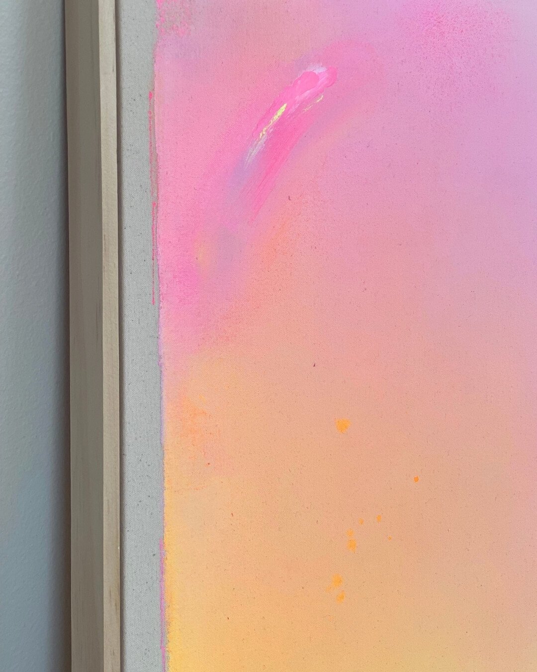 Close-up detail of subtle glitter accents and smooth color transitions in purple, pink, orange, and yellow on a canvas by Vanessa Ochi.
