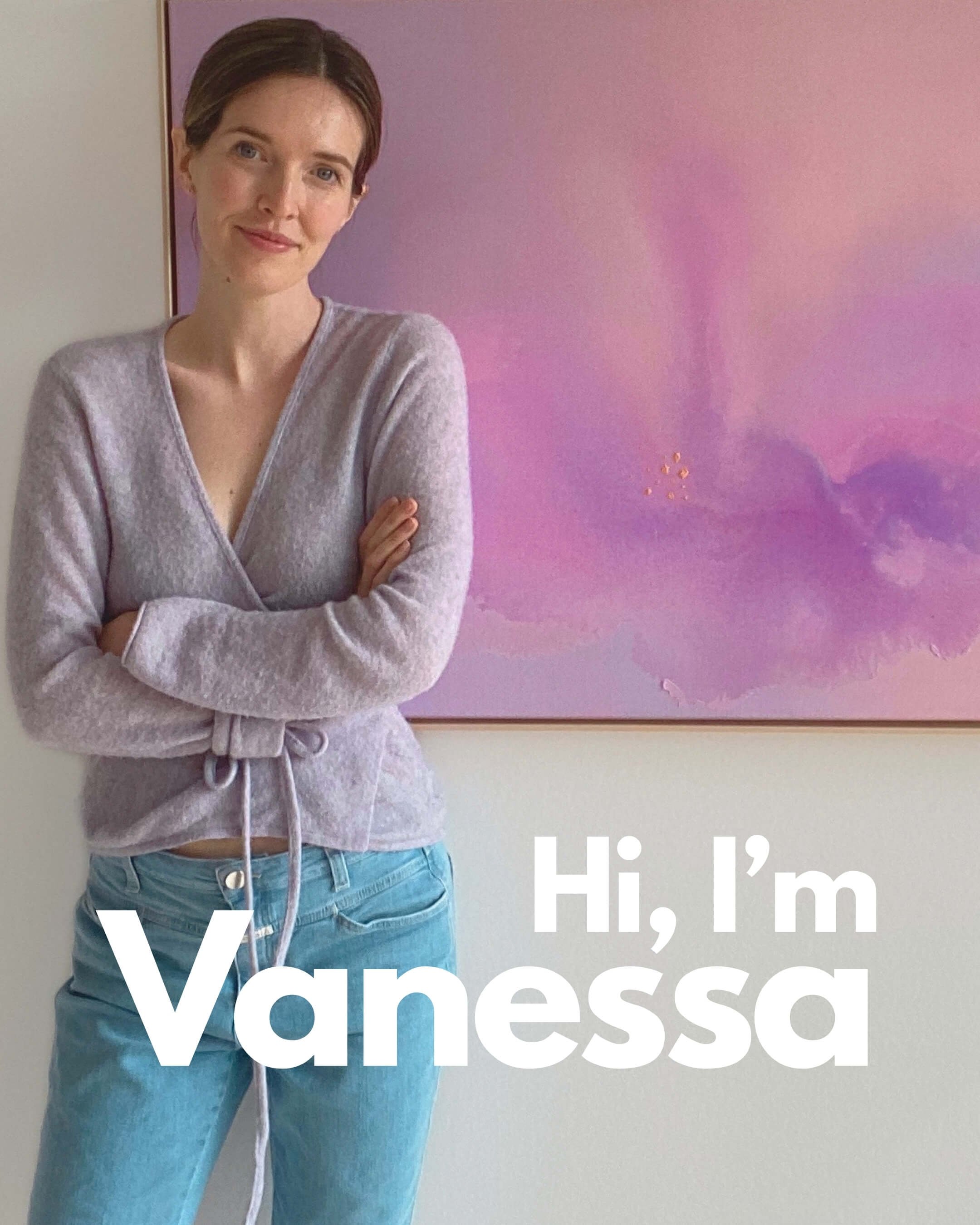 artist Vanessa Ochi behind a lilac painting from her