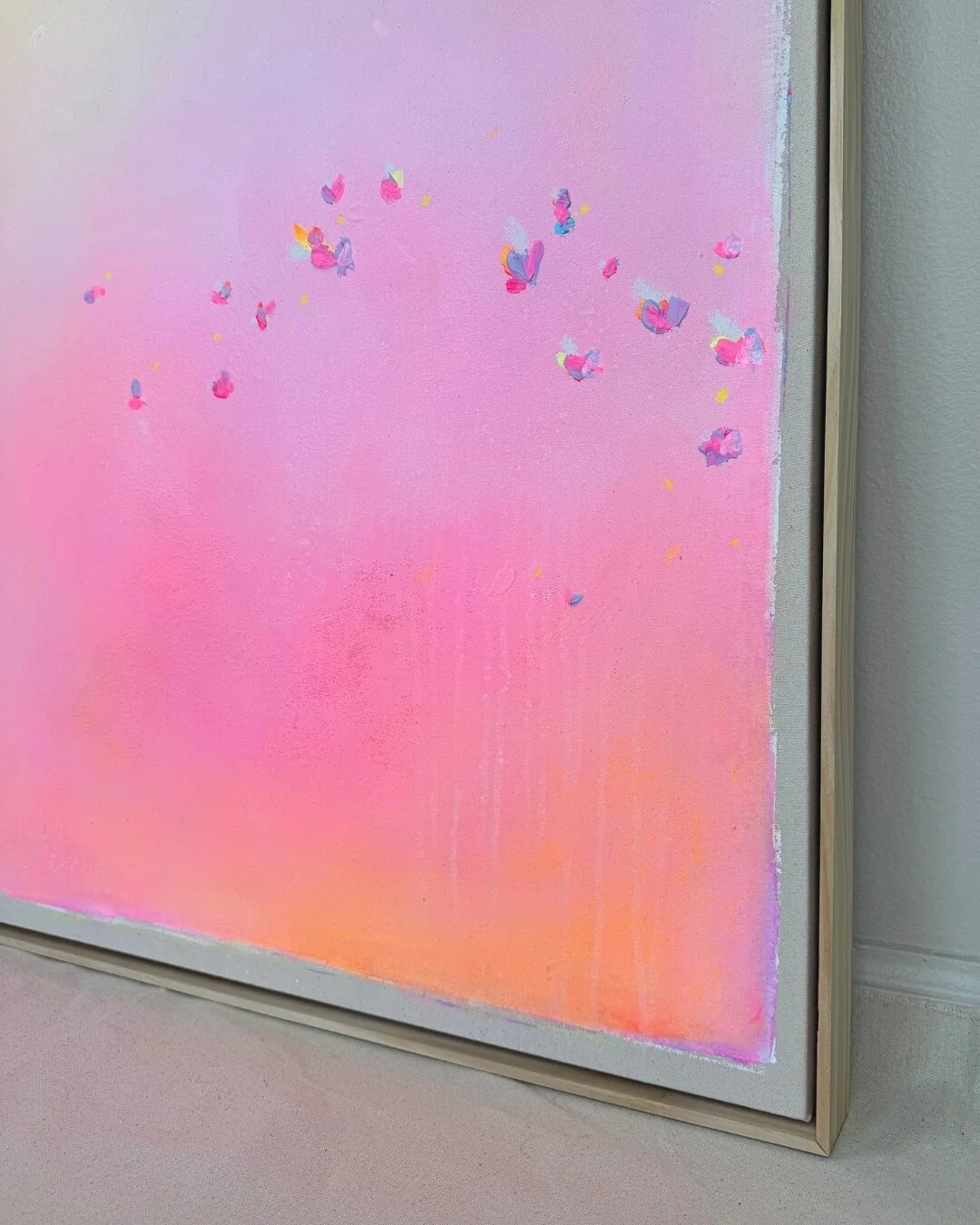 Close-up detail of subtle texture and soft pastel pink color flow from the abstract painting Summer Breeze by Vanessa Ochi.