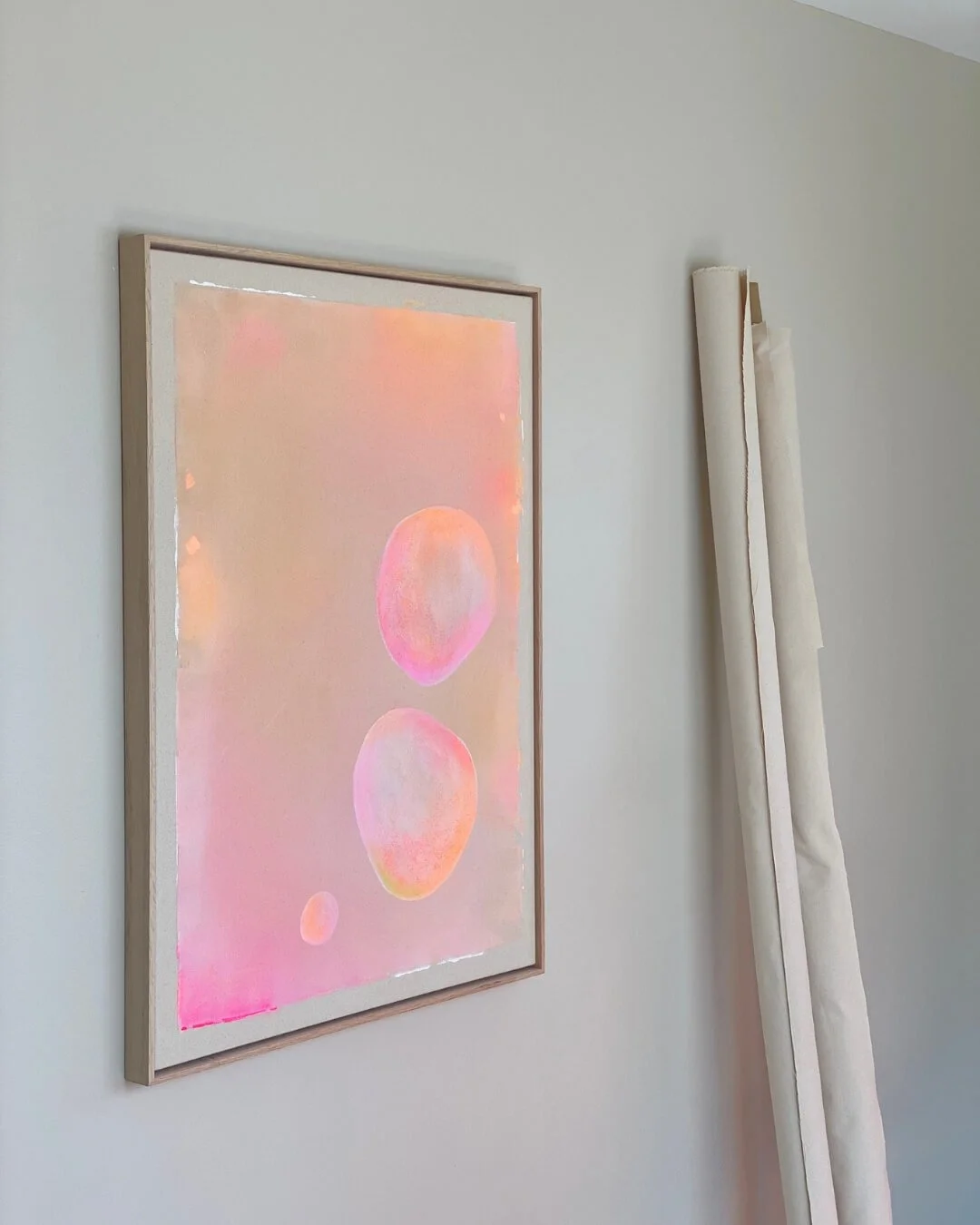 Original abstract painting featuring colorful floating bubbles with soft gradients of beige, gentle pink, and radiant orange by Vanessa Ochi.