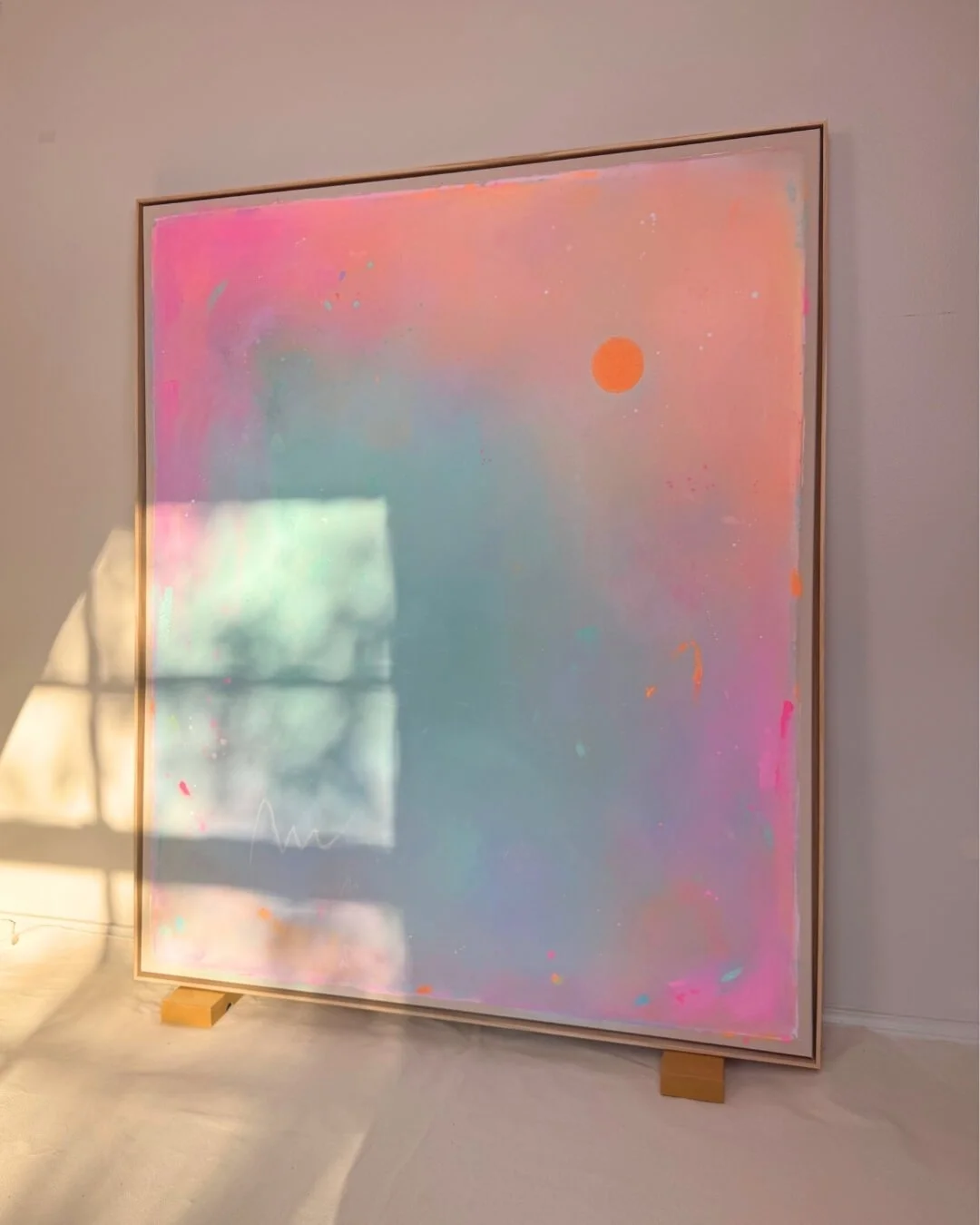 Atmospheric abstract landscape depicting a sunrise, featuring a radiant orange sun set against a soft-gradient background of turquoise, green, and pink by Vanessa Ochi
