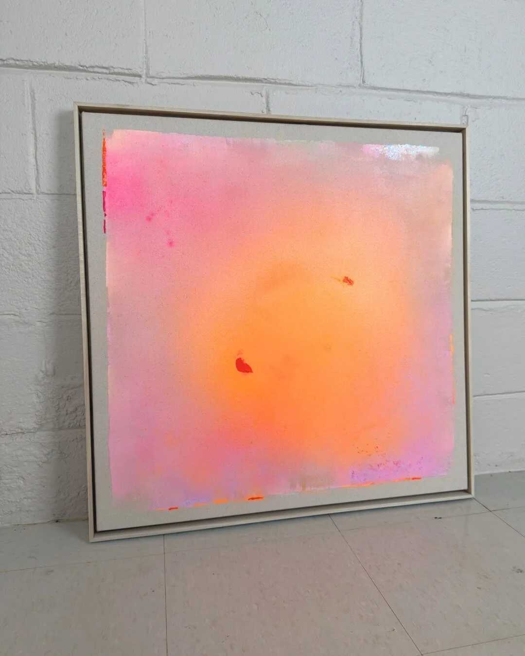 Original abstract painting from the Michigan Sun series featuring a glowing center with subtle glitter, pink and orange gradients, and soft purple accents by Vanessa Ochi.