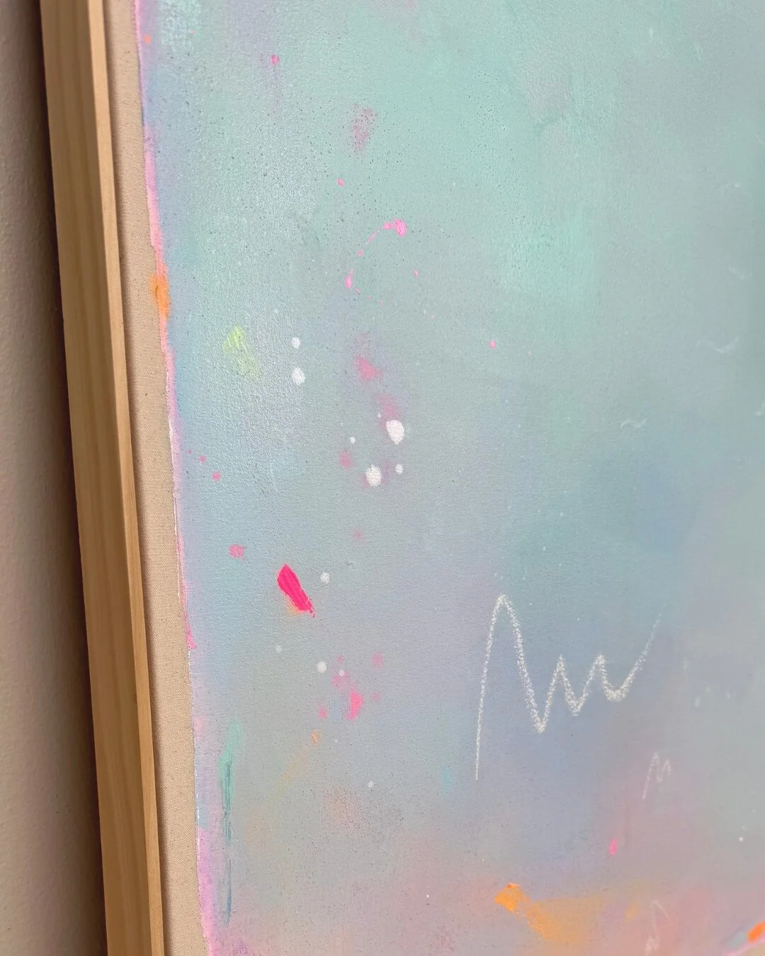 close up Atmospheric abstract landscape depicting a sunrise, featuring a radiant orange sun set against a soft-gradient background of turquoise, green, and pink by Vanessa Ochi