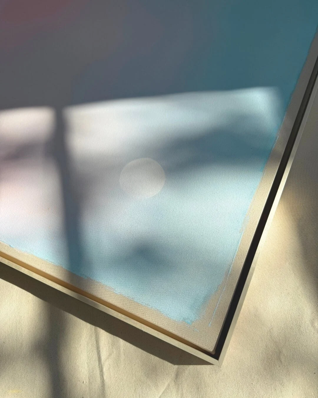A close-up shot of an artwork from the *Michigan Sun* series in pastel blue
