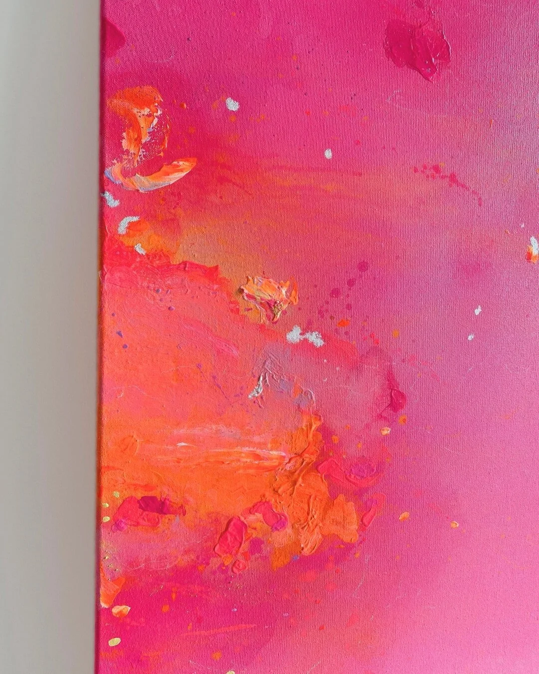 Detail shot showing smooth transitions between radiant orange, rose, and deep pink hues with subtle canvas texture by Vanessa Ochi
