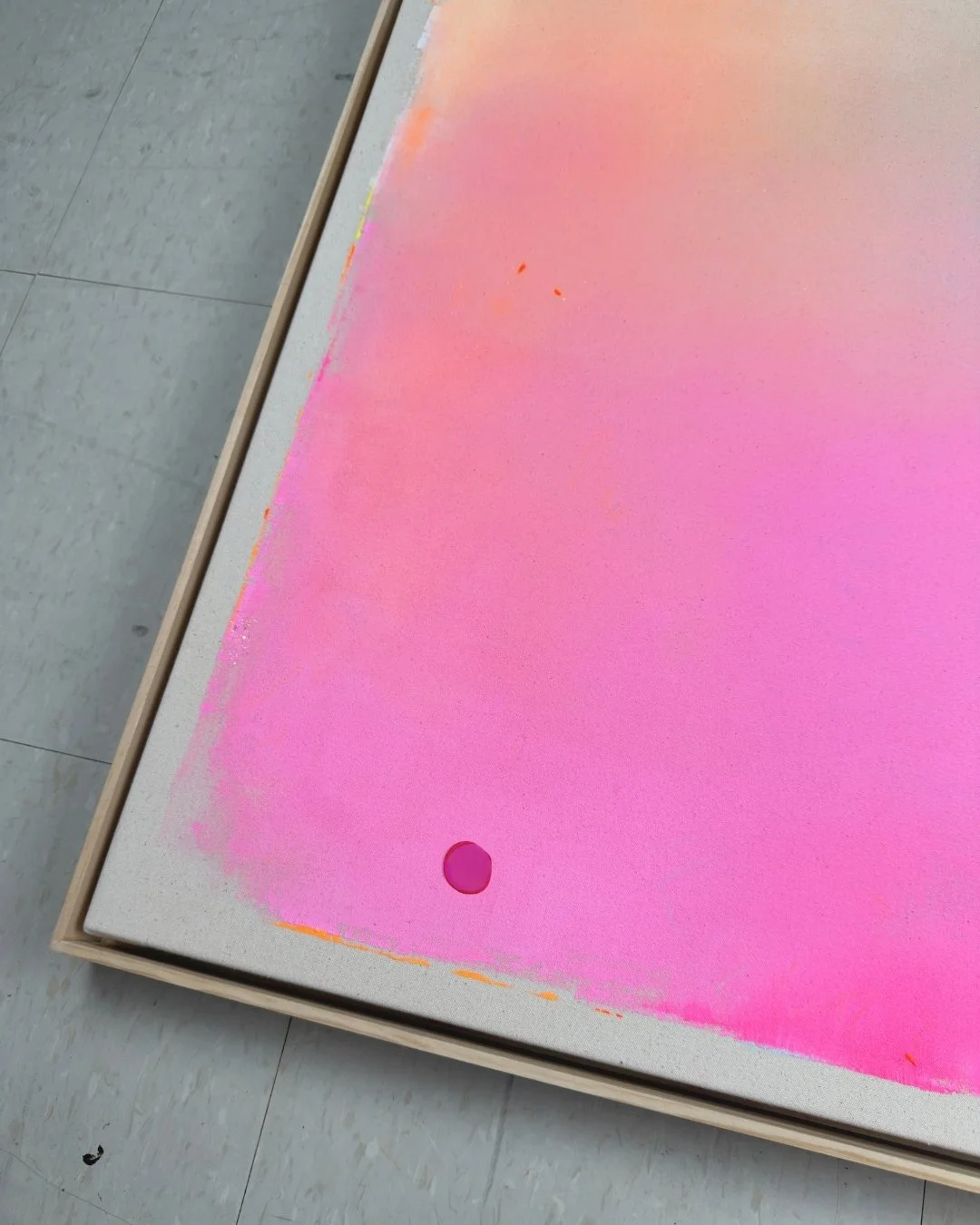 Close-up detail of a canvas art piece showing the shimmering, rainbow-like holographic effect of the full moon over smooth pink and blue paint gradients by Vanessa Ochi