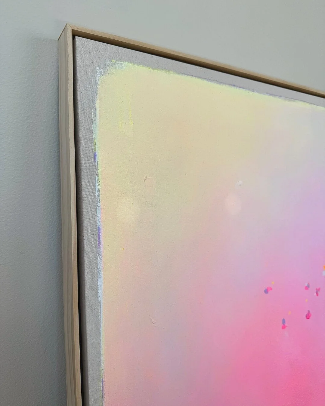 Close-up detail of subtle texture and soft pastel pink color flow from the abstract painting Summer Breeze by Vanessa Ochi.