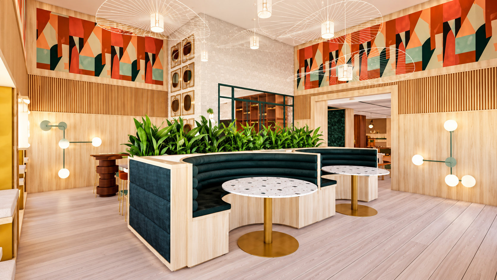 Bright, modern interior of a restaurant or café with circular booths, marble tables, green plants, geometric lighting fixtures, and colorful abstract artwork on the upper walls.