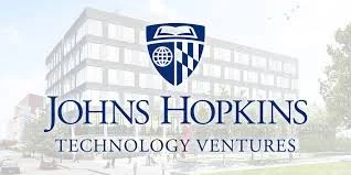 Johns Hopkins Technology Ventures logo with a building and trees in the background