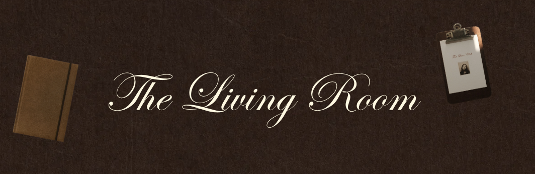 A wall sign reading "The Living Room" with a small picture holder and a closed book on a dark brown textured background.