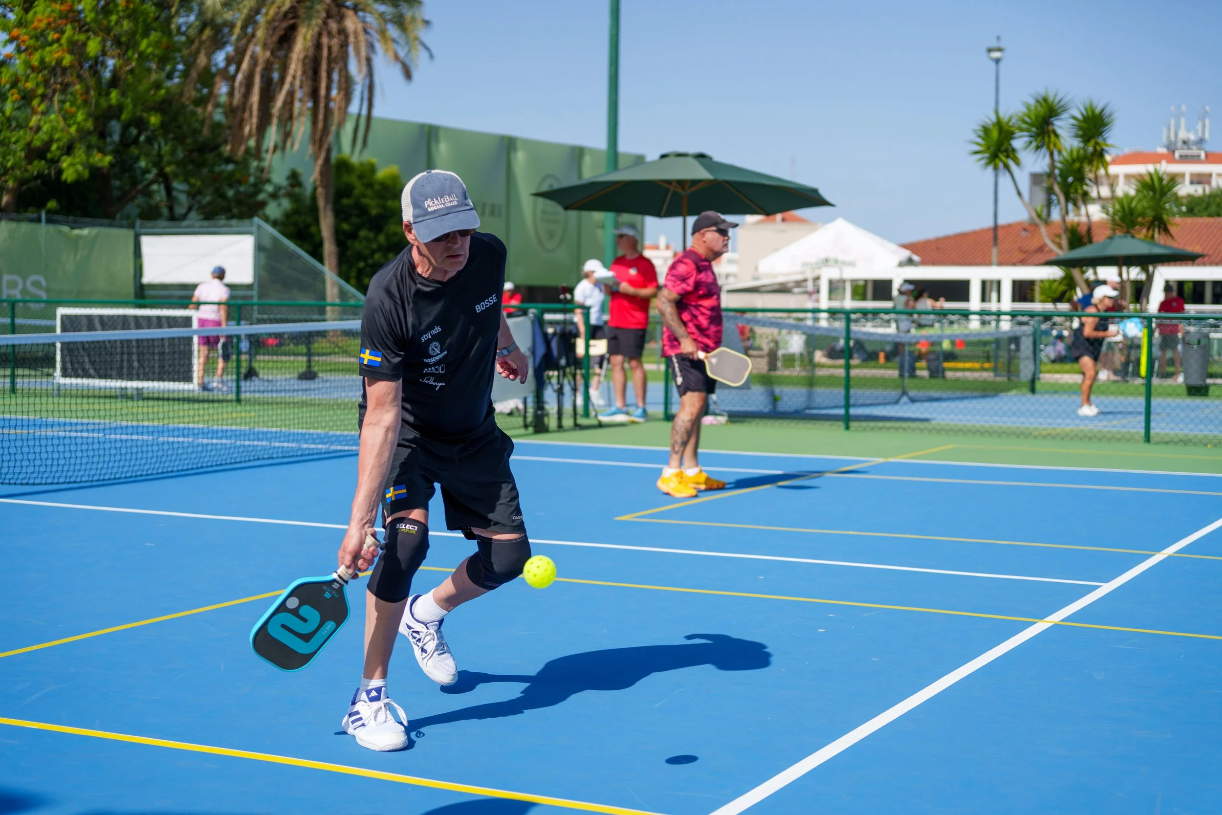 A player hitting a pickleball during the Lisboa Open