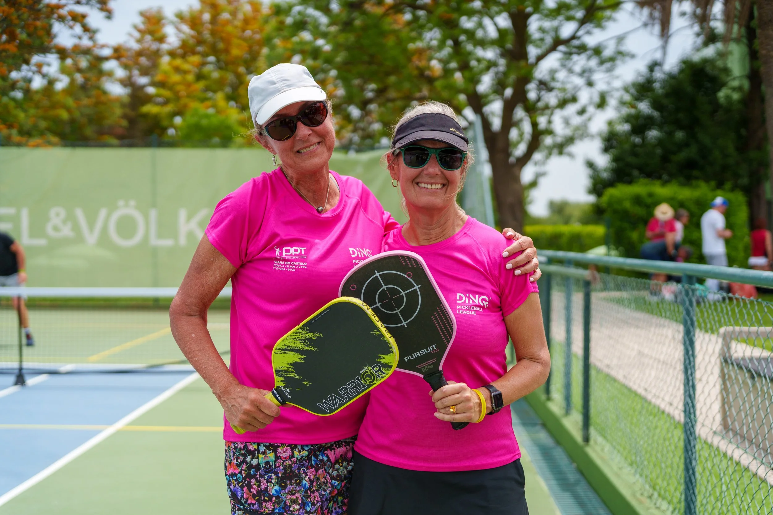 Matching teammates smiling during the Lisboa Open