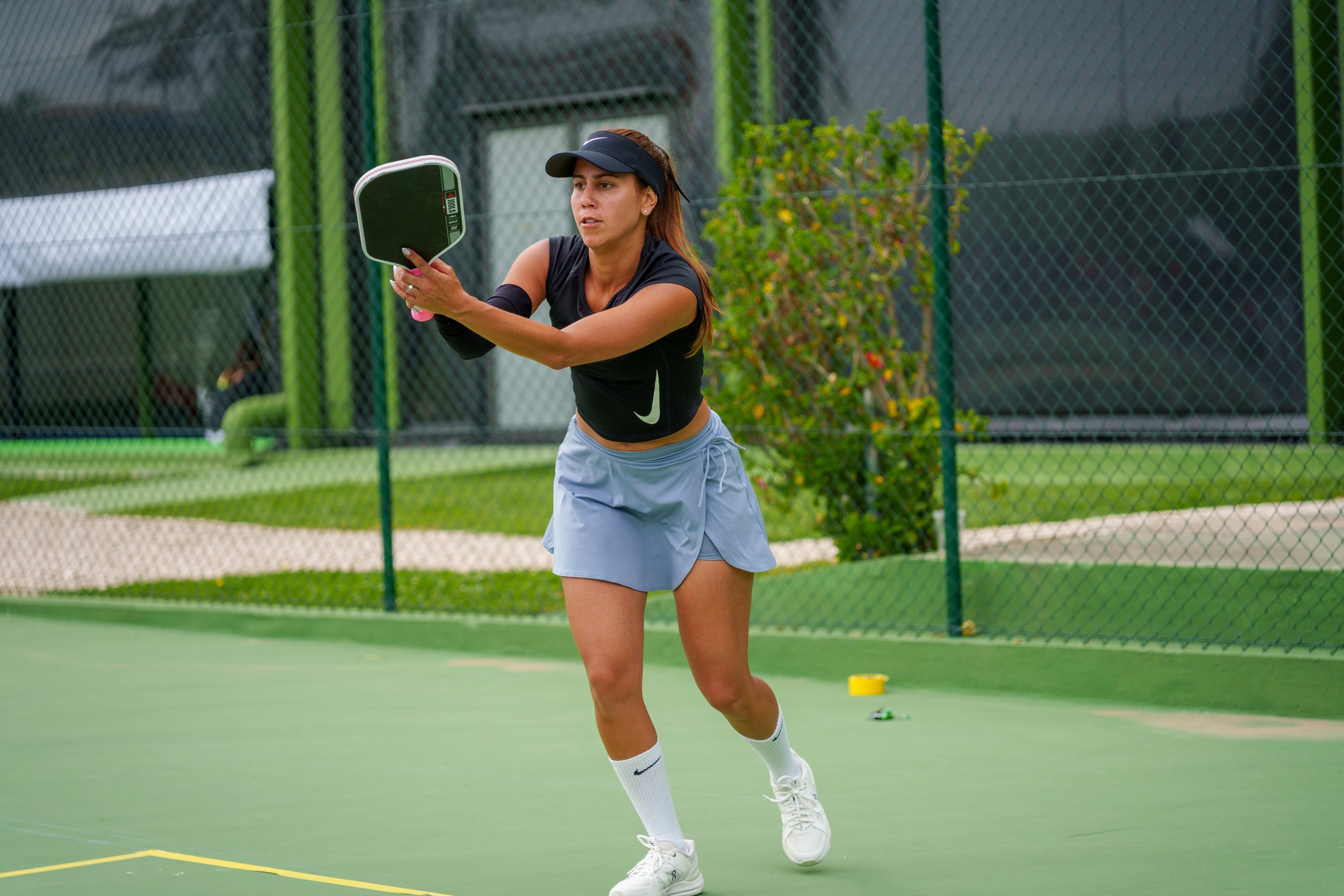 A player hitting a pickleball during the Lisboa Open