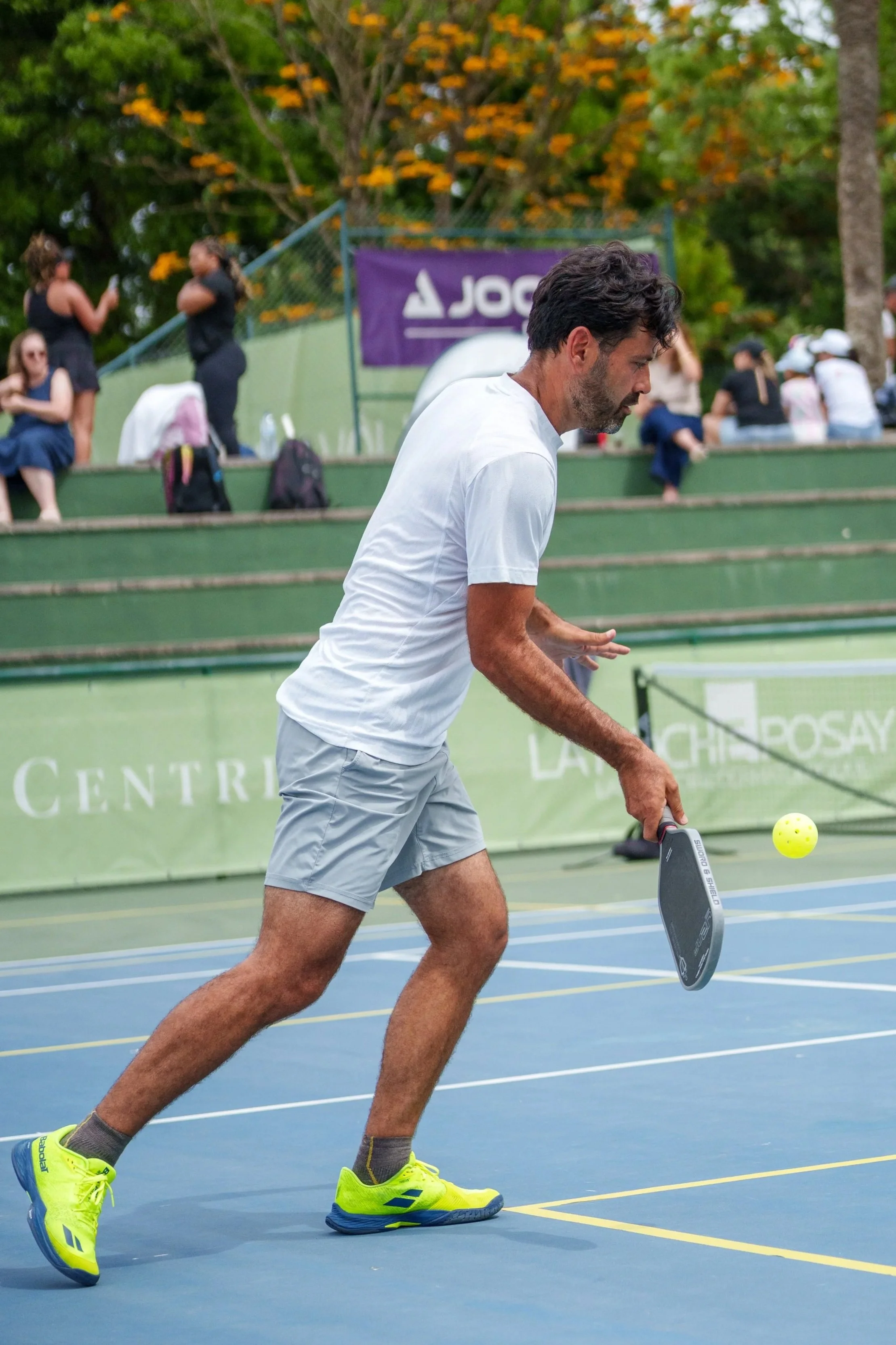 A player hitting a pickleball during the Lisboa Open