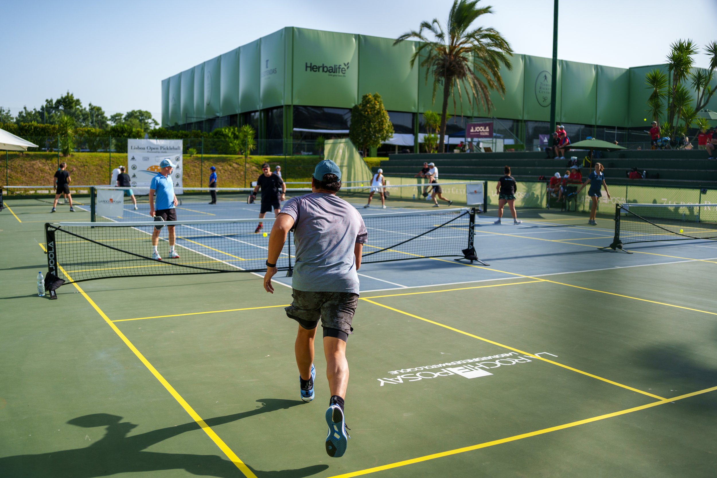 A player hitting a pickleball during the Lisboa Open