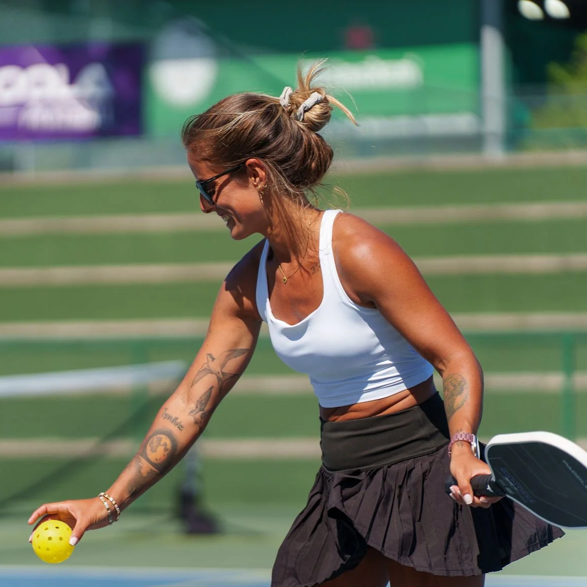 Lisbon Open pickleball tournament game with a player hitting a pickleball on the pickleball court