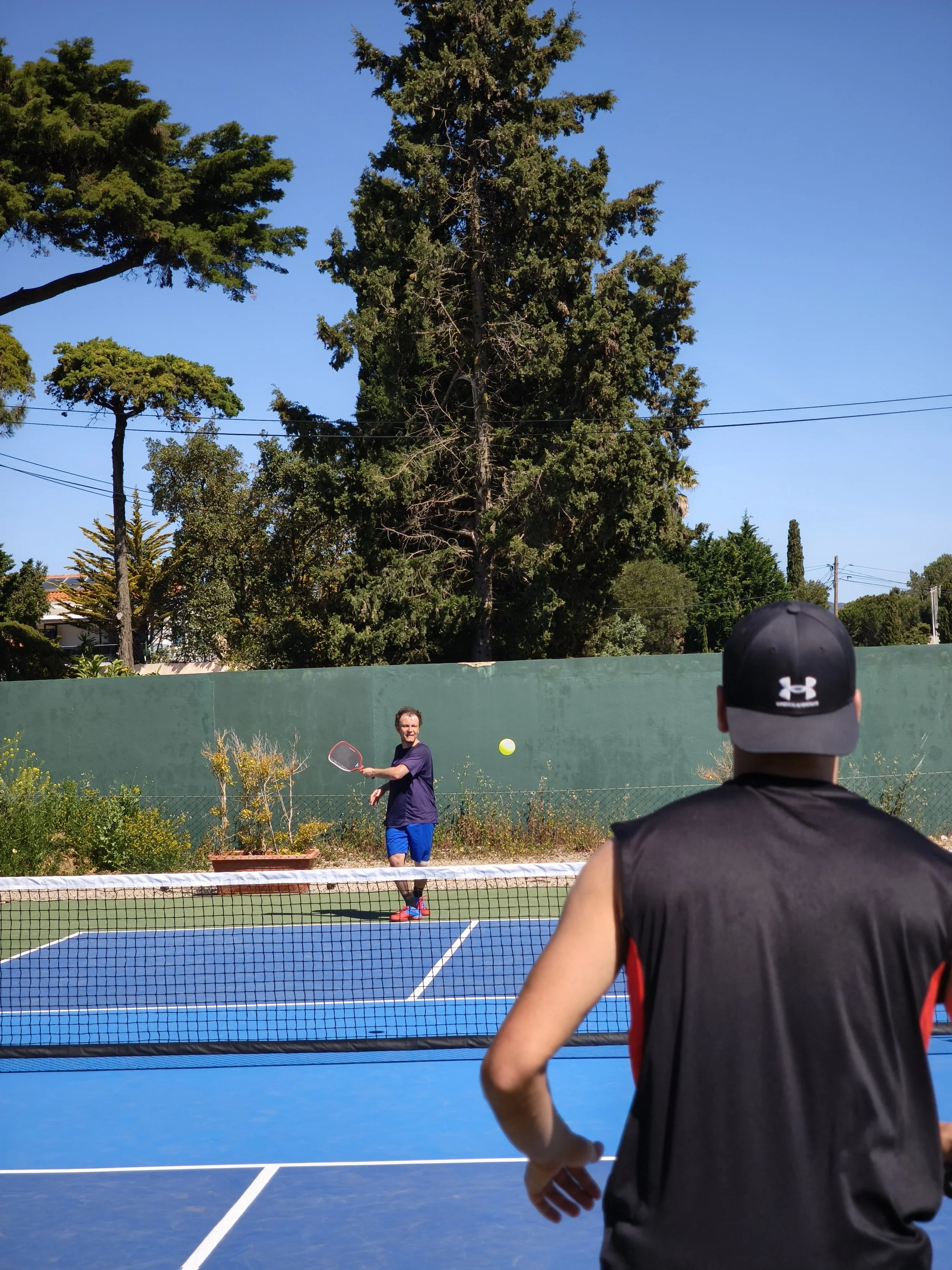 Two pickleball players playing pickleball in Lisbon