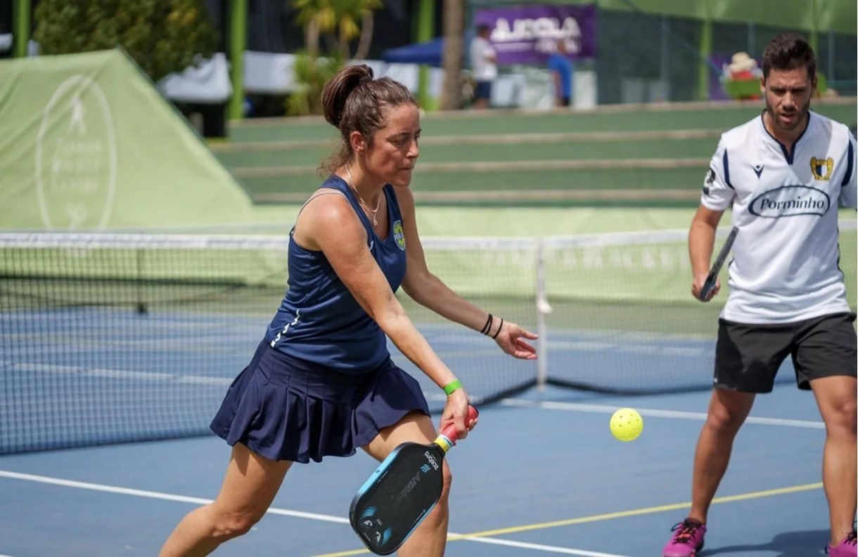 A player hitting a pickleball during the Lisboa Open
