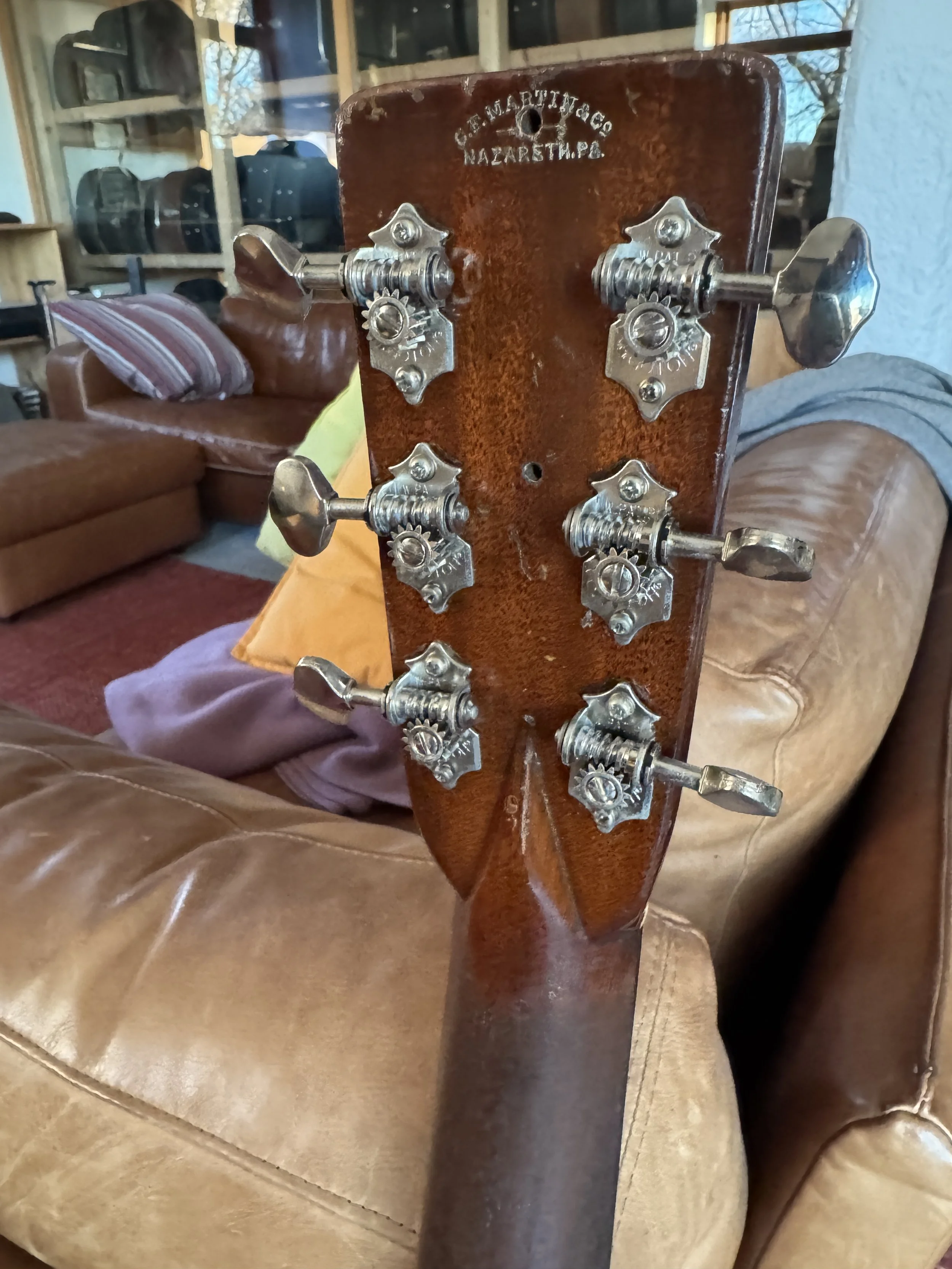 Close-up of the headstock back of a converted Martin C-2 guitar