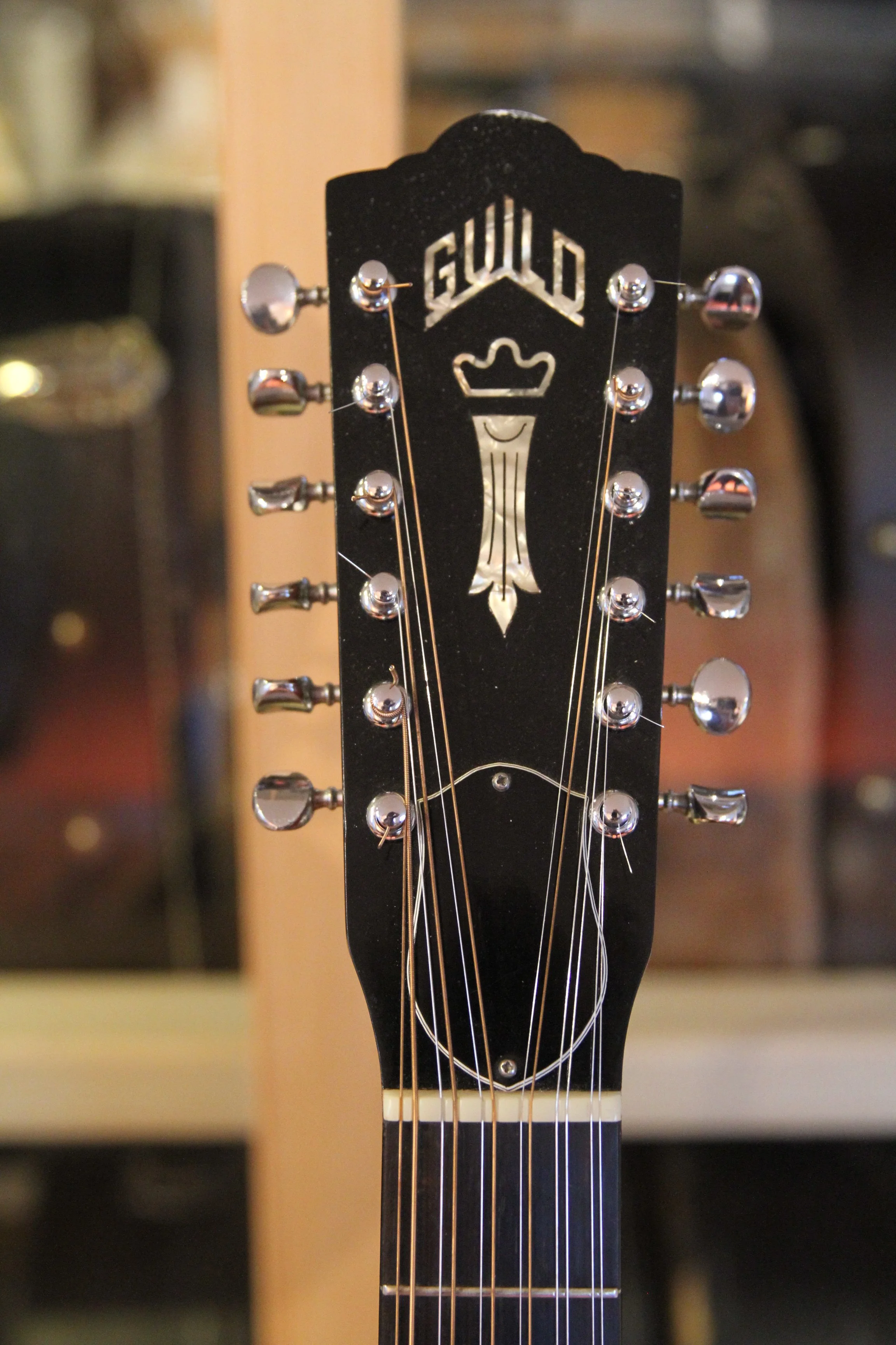 headstock with inlayed logo, tuners, Guild F-212 XL