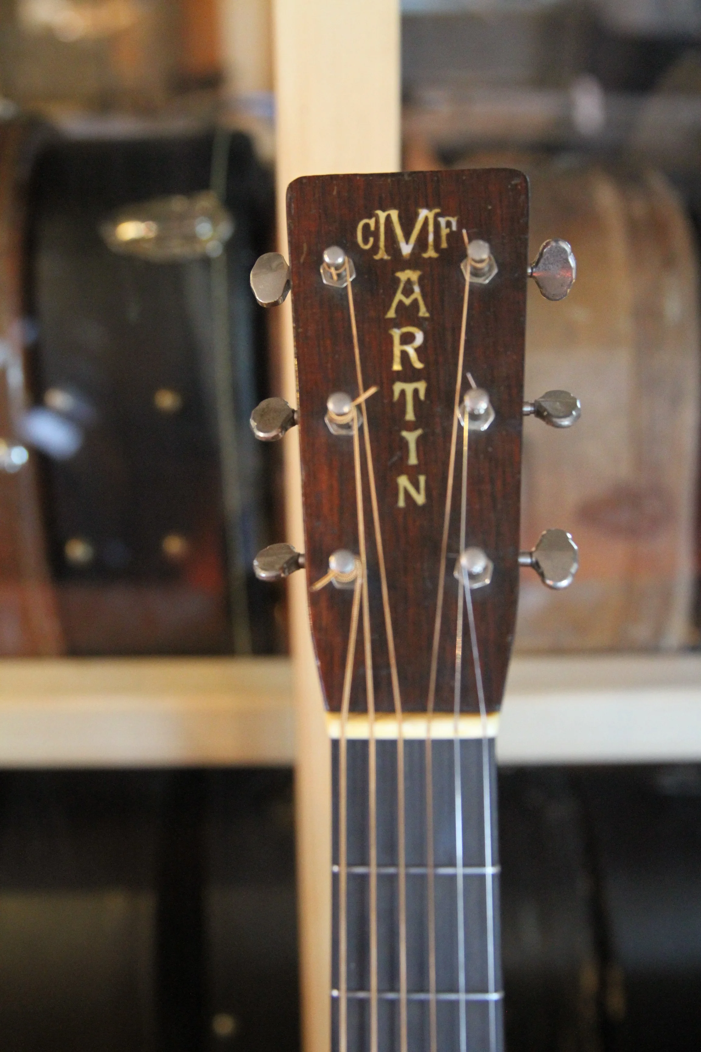 headstock of converted prewar Martin arch-top guitar