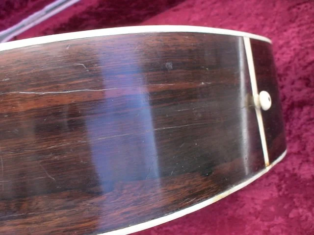 buttom with endpin of a Martin 00-28, 1919