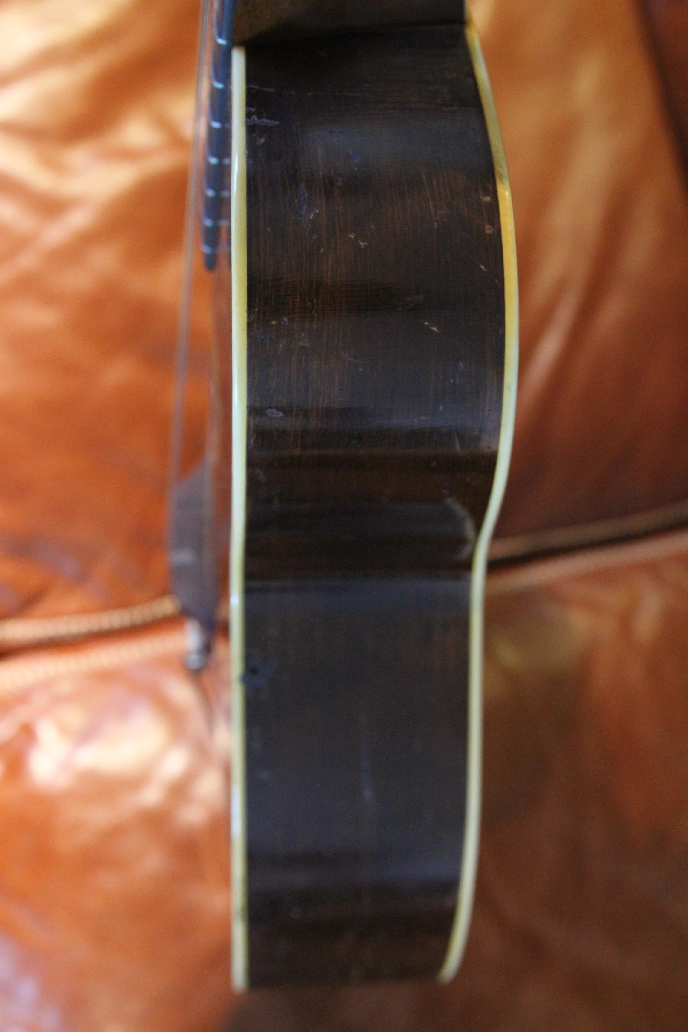 close up of the treble-side of double bound vintage guitar