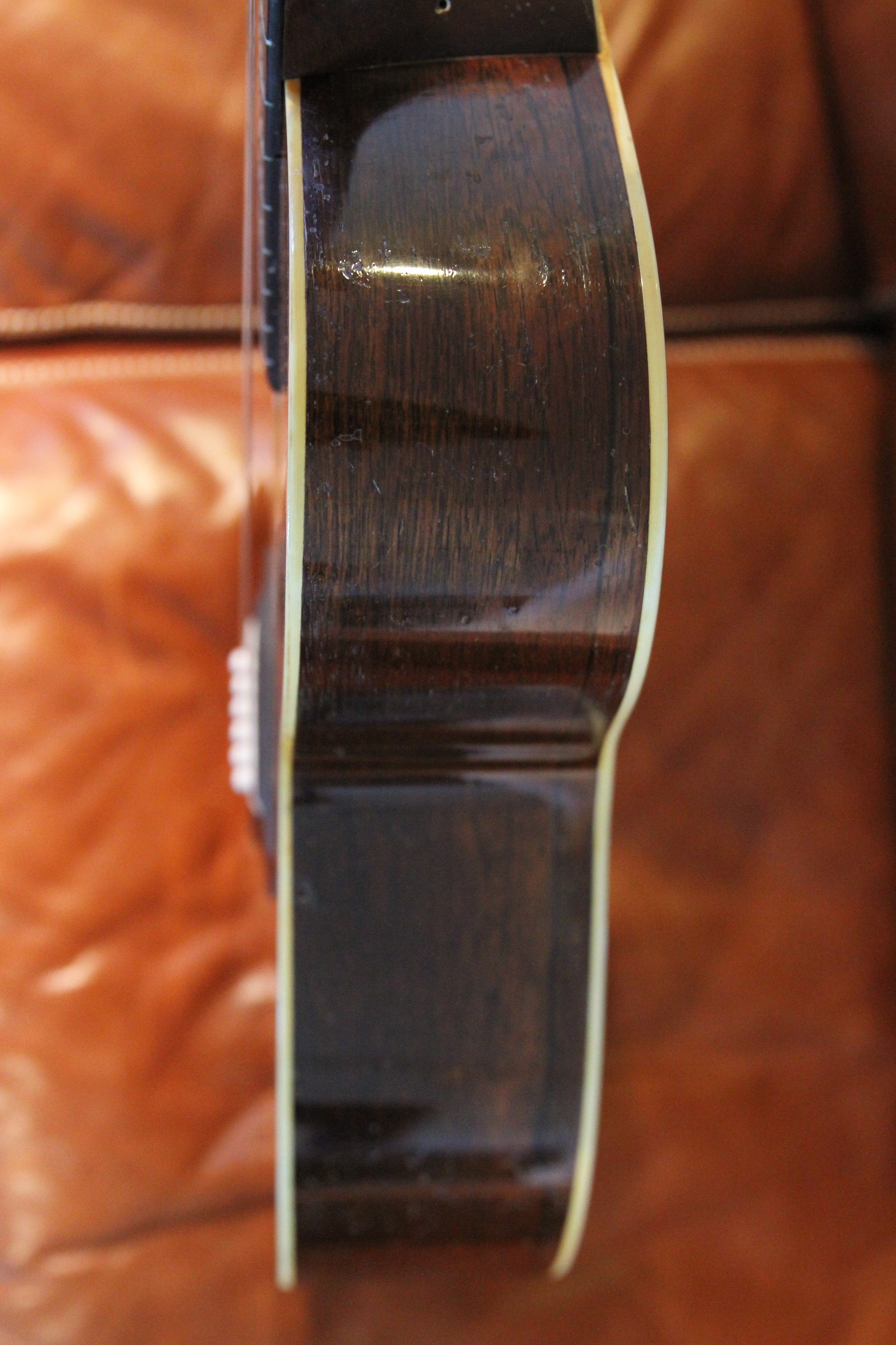 treble side of a vintage prewar brazilian rosewood body guitar