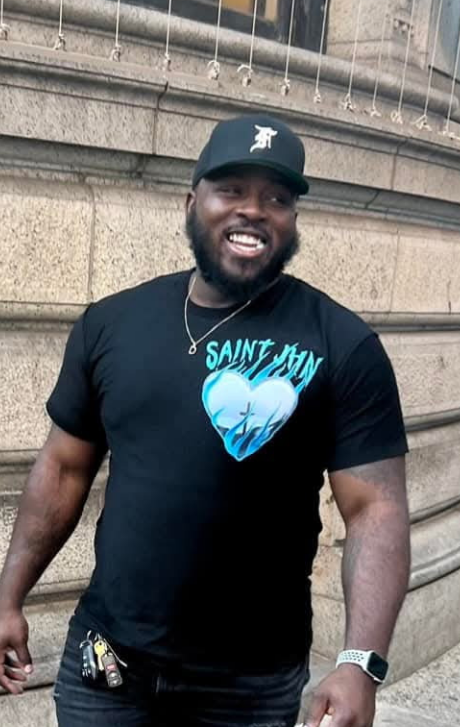 Deacon smiling in one of his favorite t-shirts