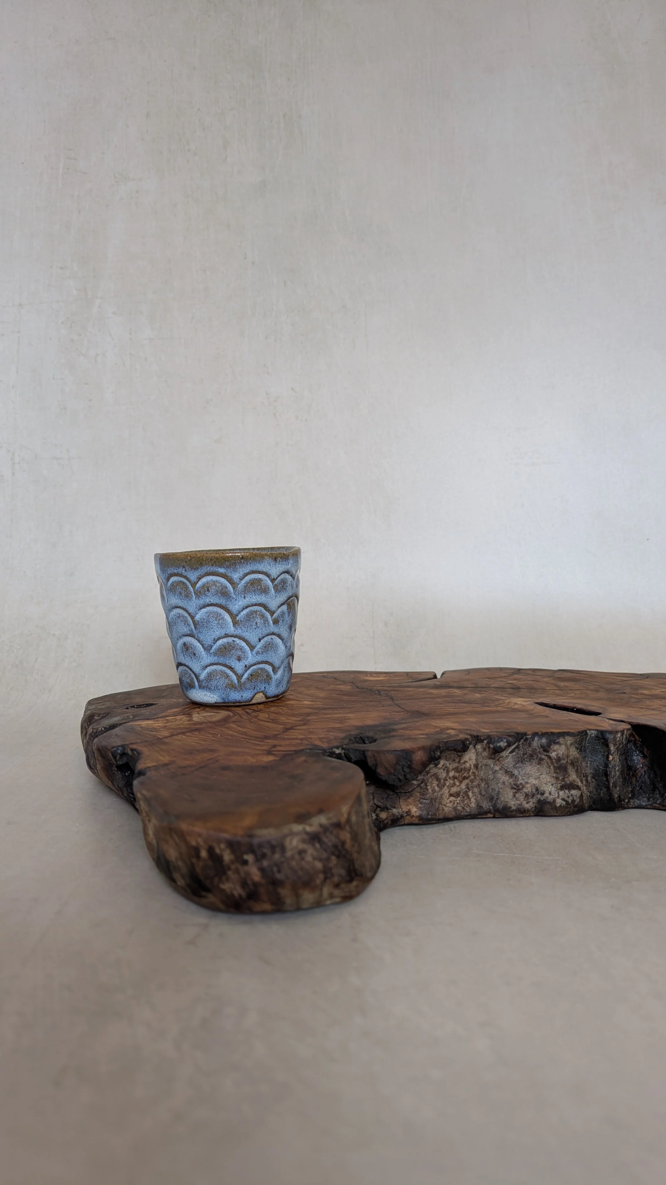 little-cup-in-blue-glaze-on-olive-wood.jpg.jpg