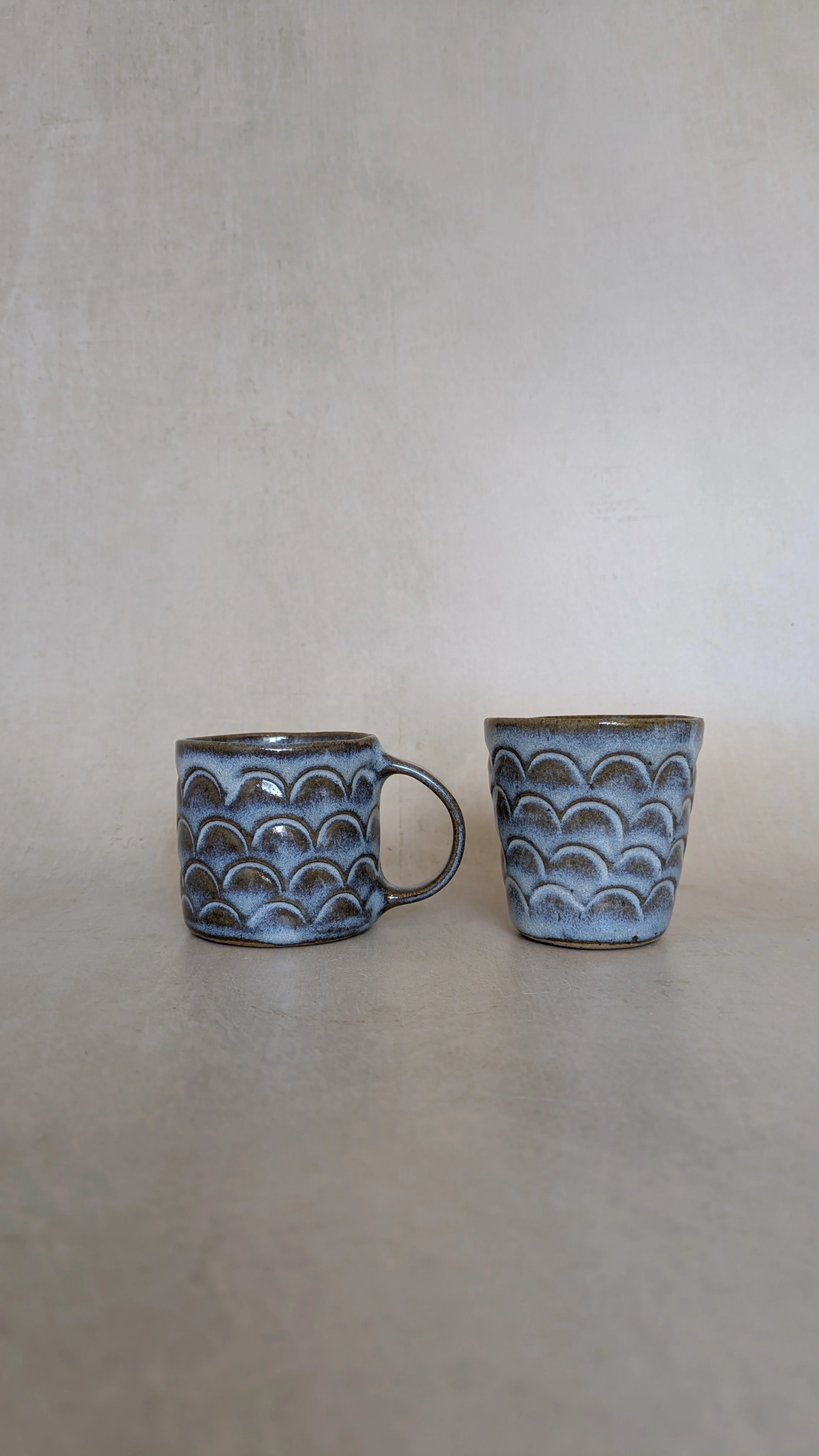 little-blue-mug-and-cup-with-arch-texture.jpg.jpg