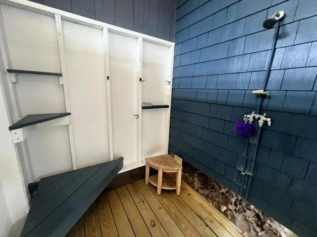 Outdoor shower with plenty of room for your toiletries