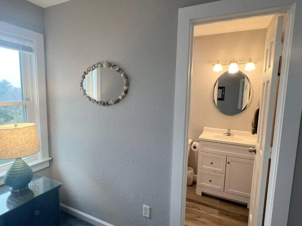 Primary bedroom view to bathroom