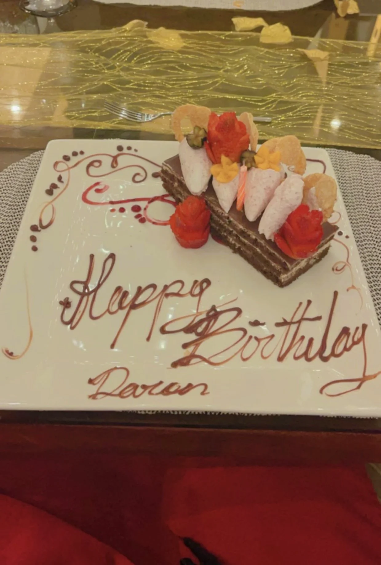 Birthday celebration dessert served at a luxury resort during vacation.