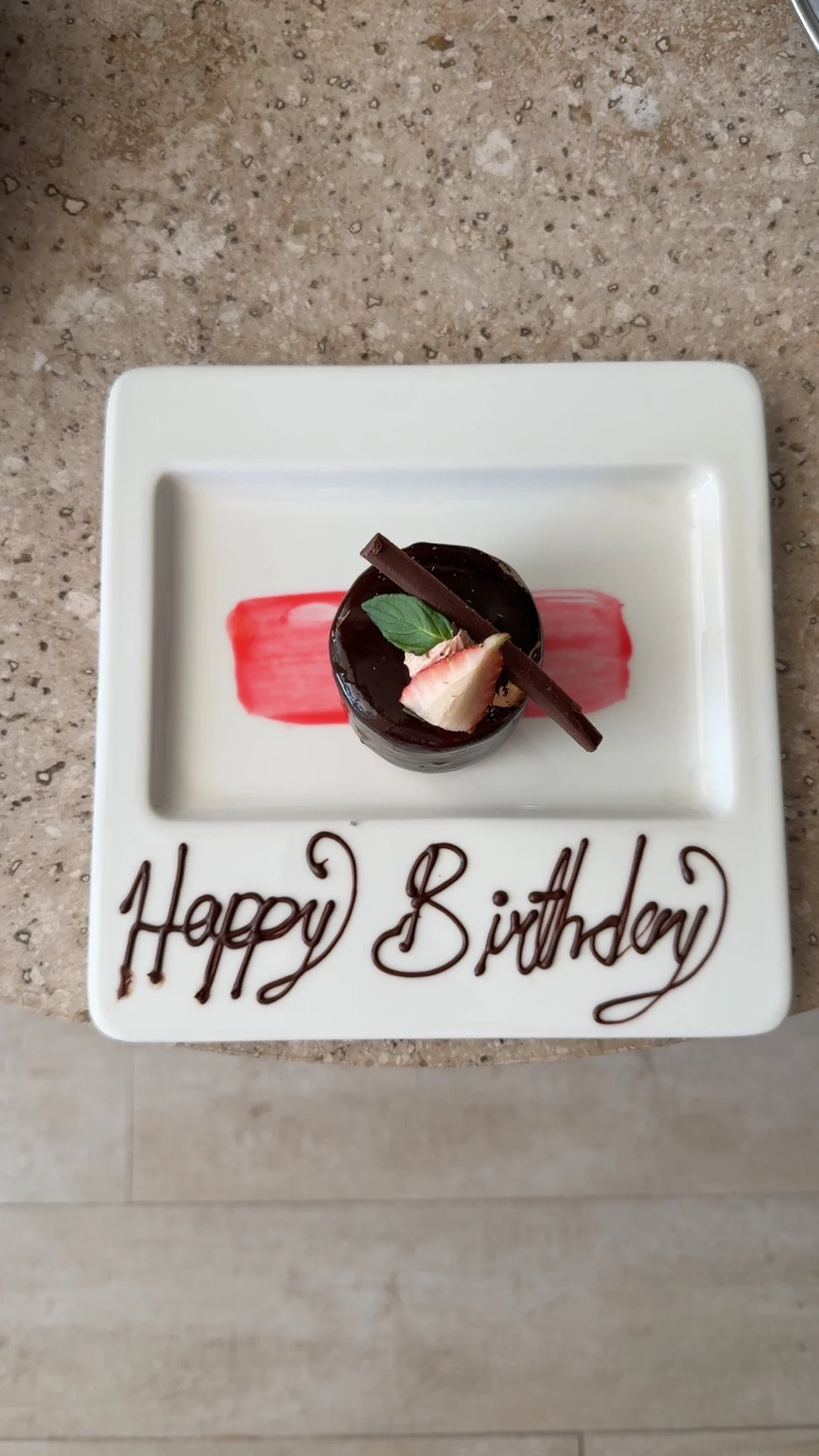 Special birthday dessert presented during a tropical resort vacation.